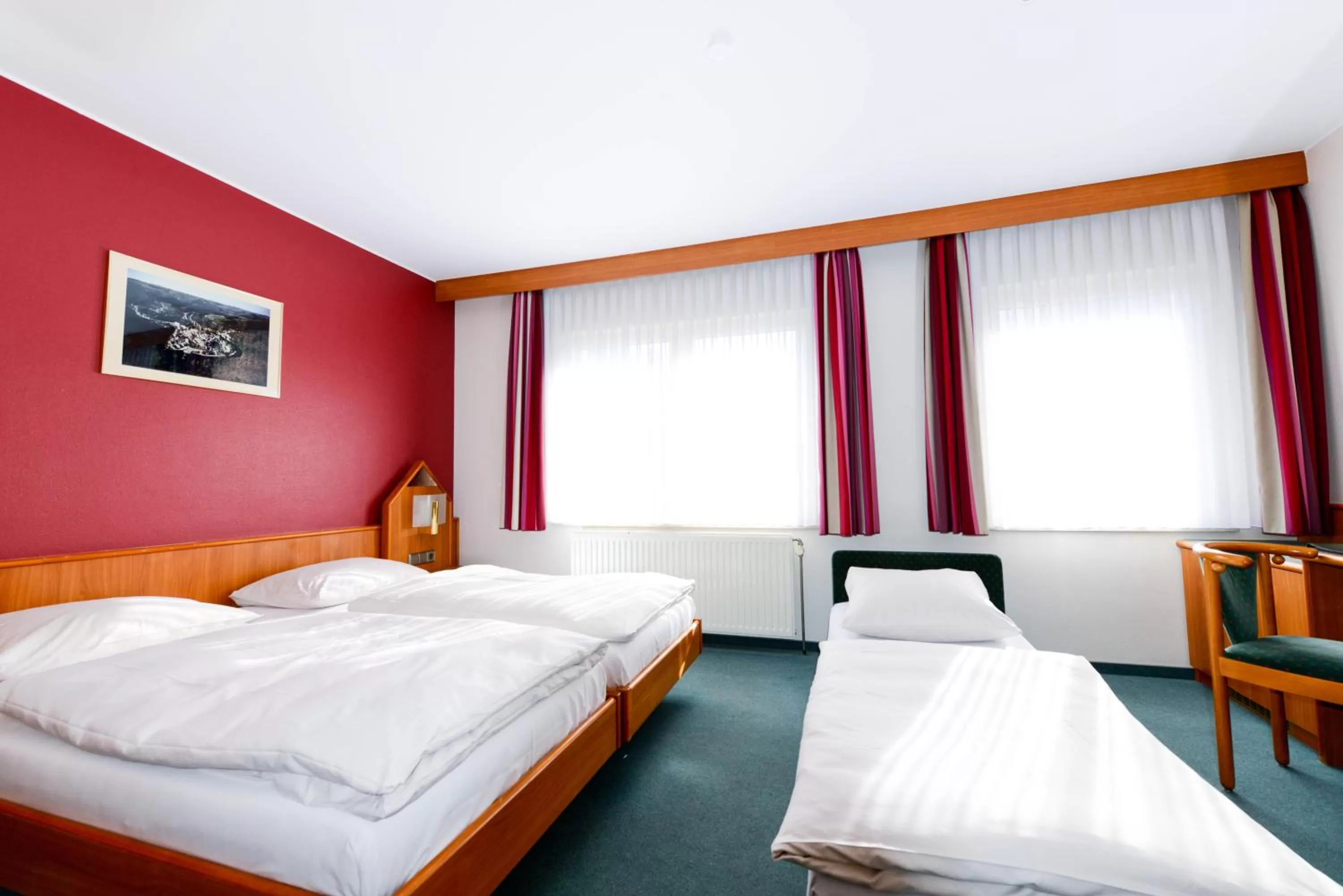 Bed in Hotel Christophe Colomb