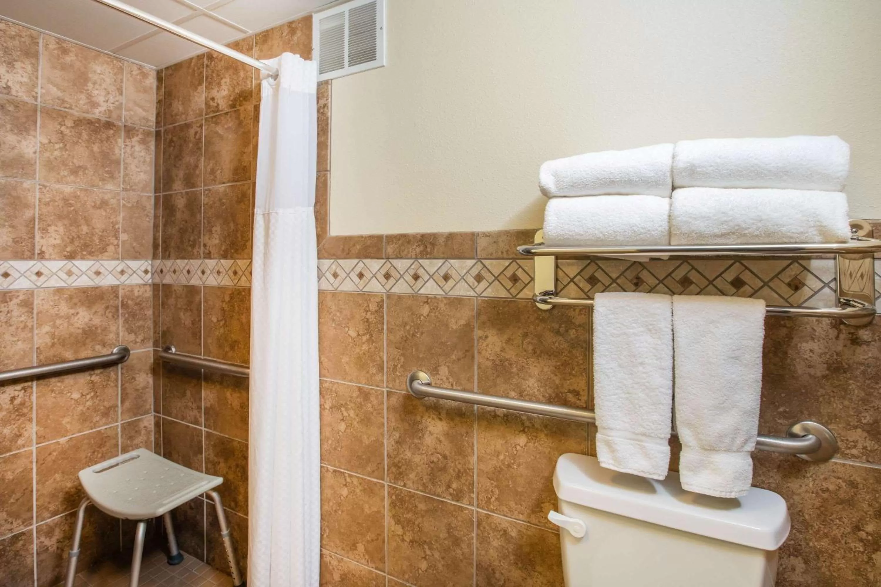 Shower in AmericInn by Wyndham Grand Forks