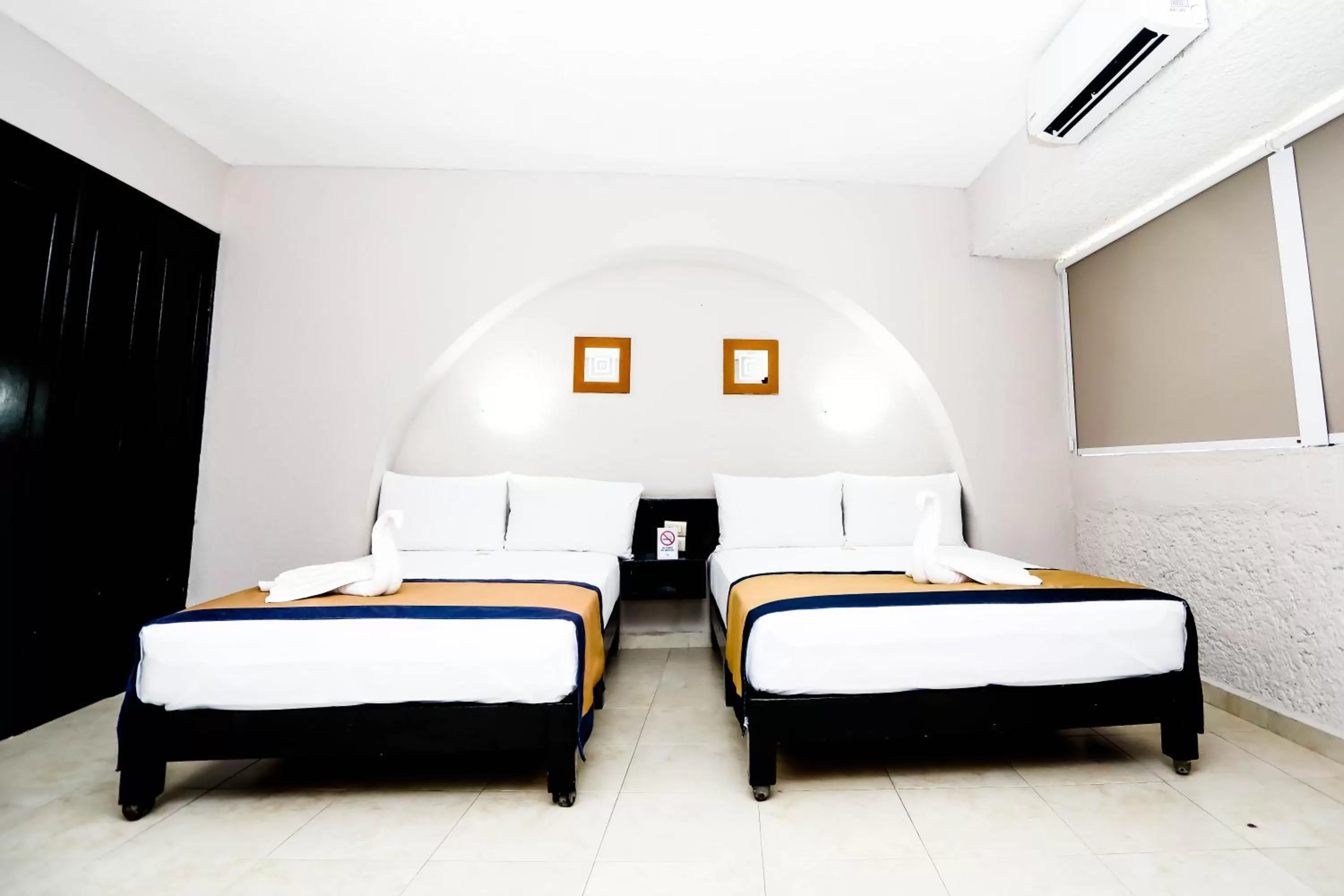 Bed in Hotel Caribe Internacional Cancun
