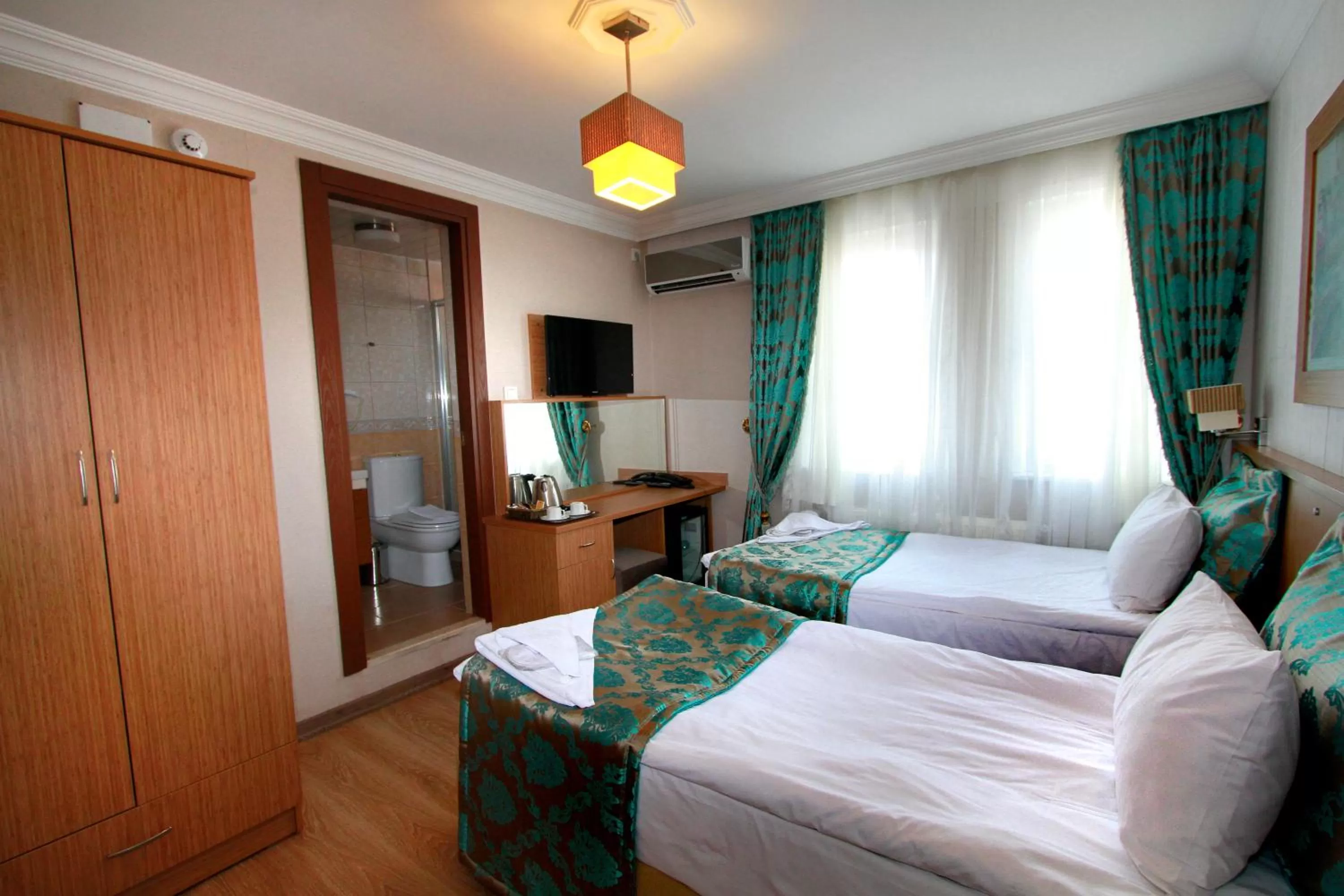 Bed in Agora Boutique Hotel & Bistro