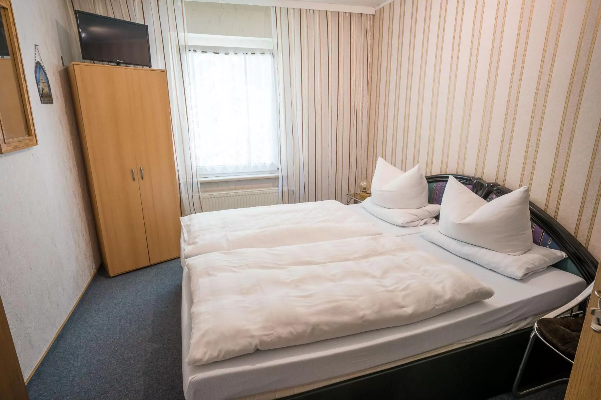 Photo of the whole room, Bed in Waldgaststätte Sennhütte