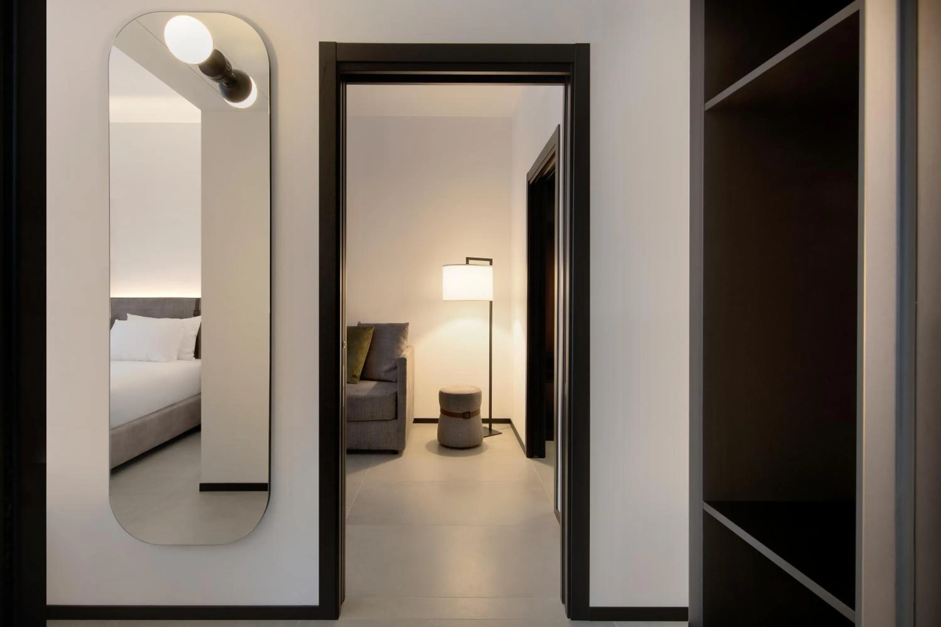 Seating area, Bed in J Hotel