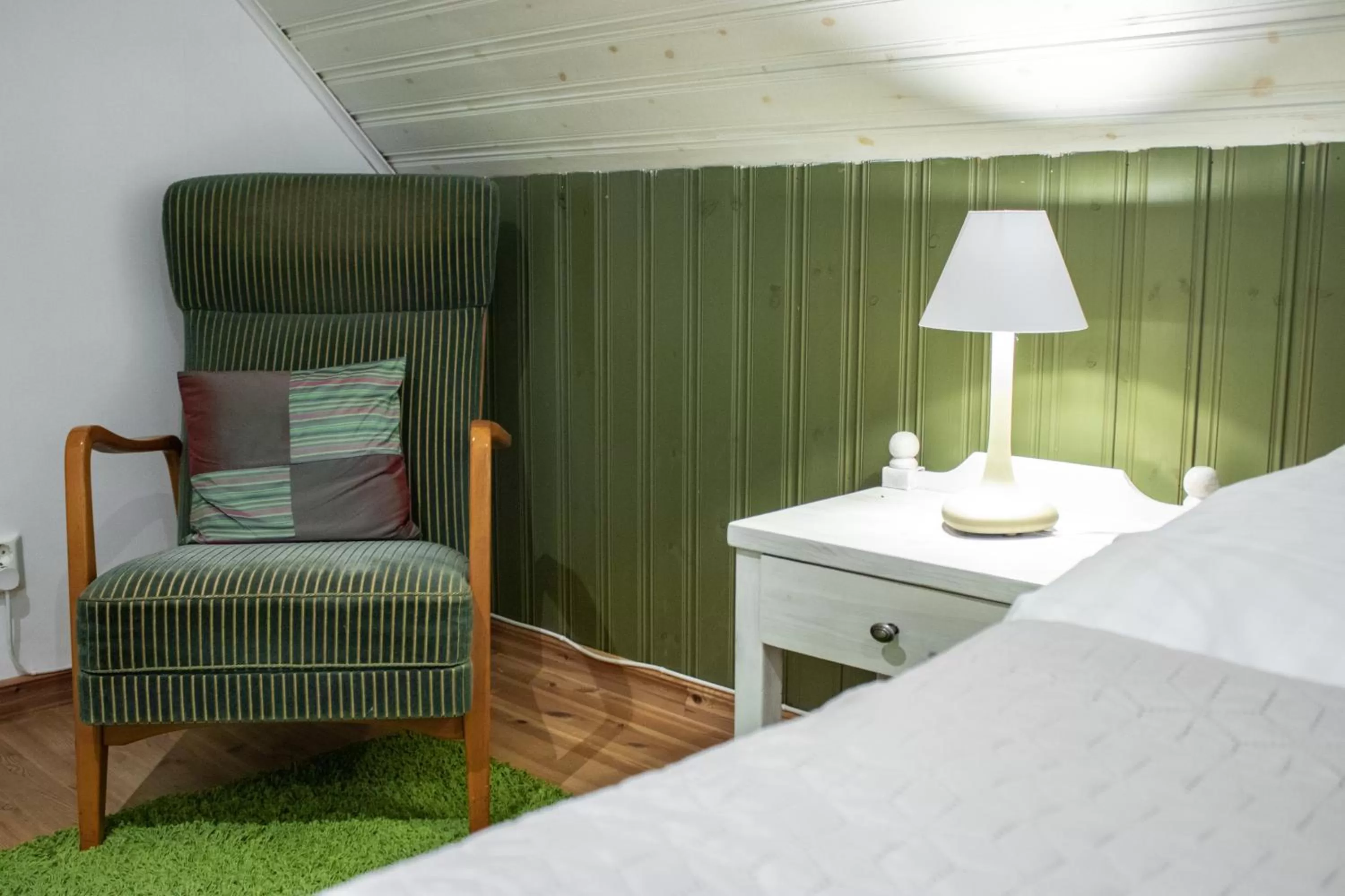 Seating area, Bed in Stora Herrestad B&B