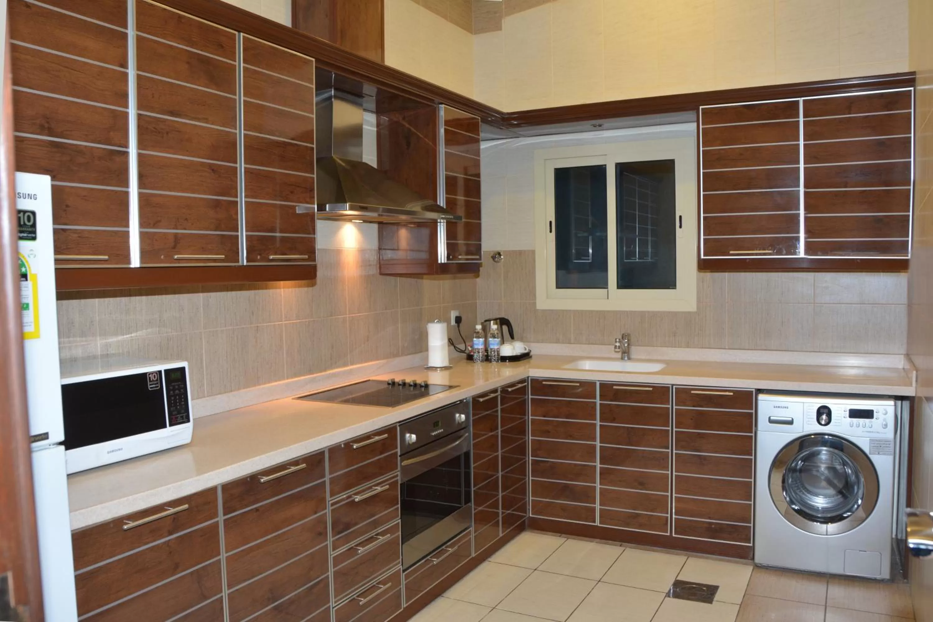 Kitchen or kitchenette in Mandarin Alshamal Hotel Apartments