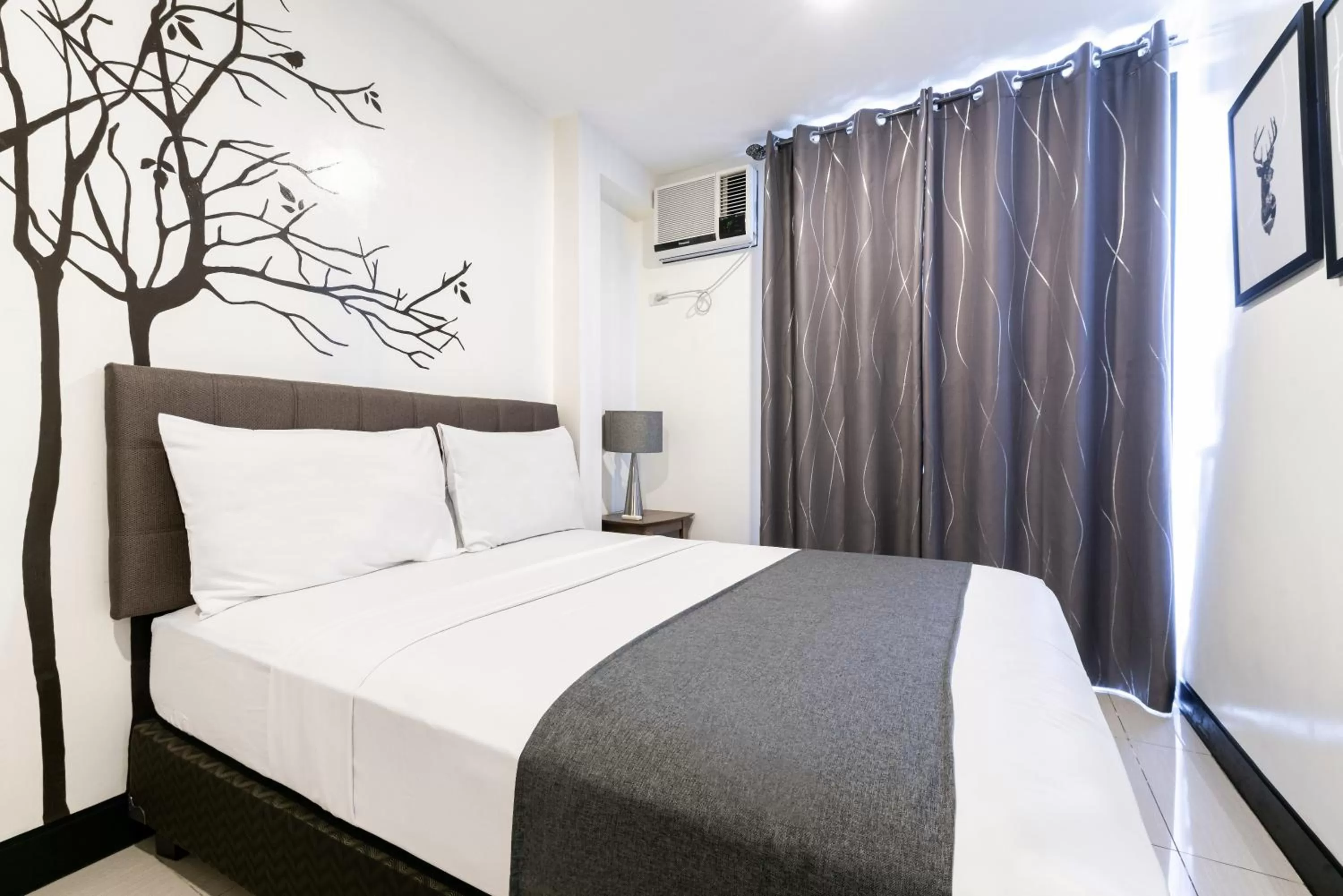 Bedroom, Bed in Artemis Place Makati Hotel