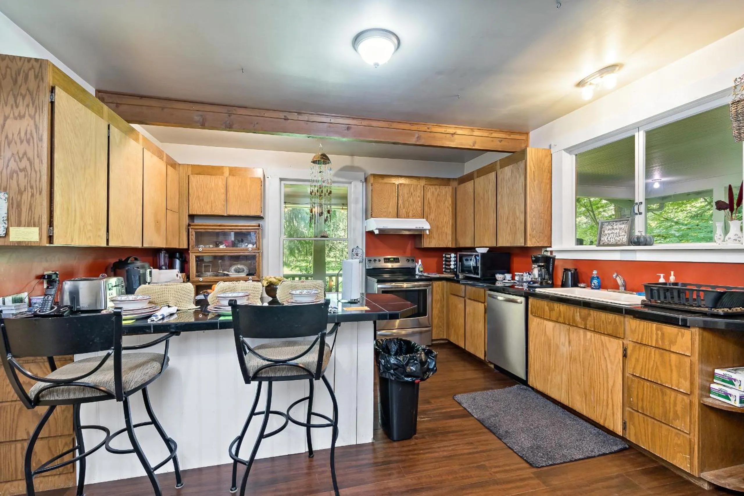 Communal kitchen in Mountain Meadows Inn & Chalet Suites