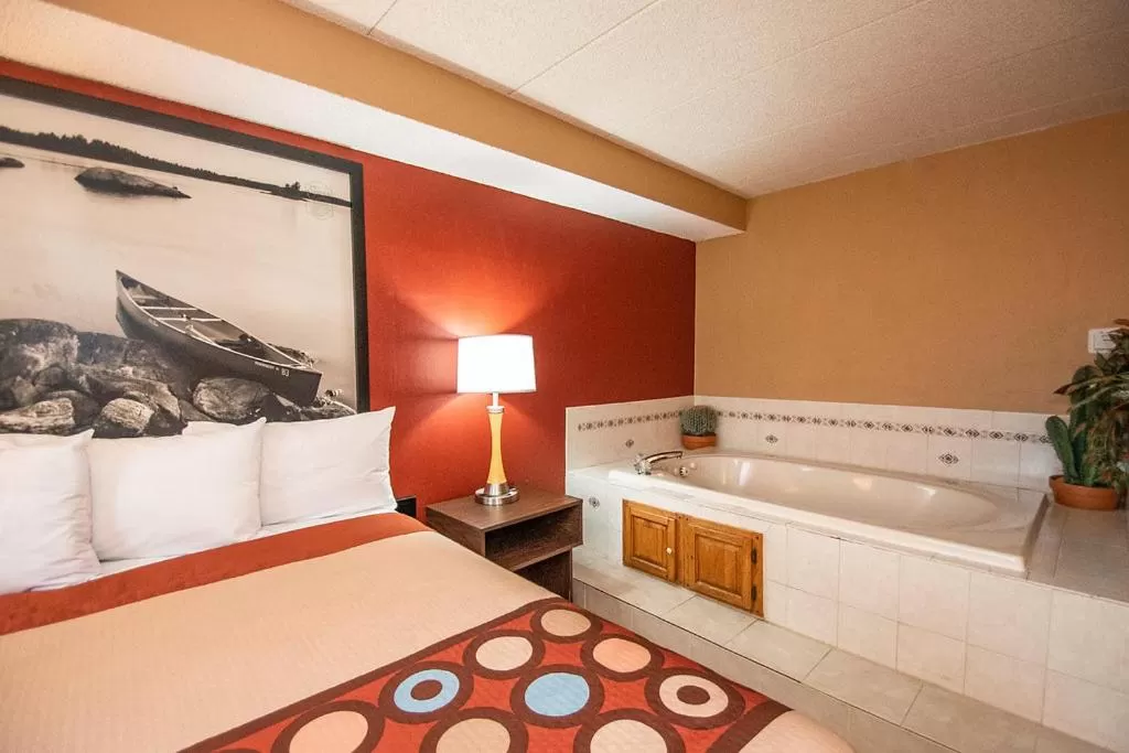 Bed in Super 8 by Wyndham Brooklyn Center/MPLS