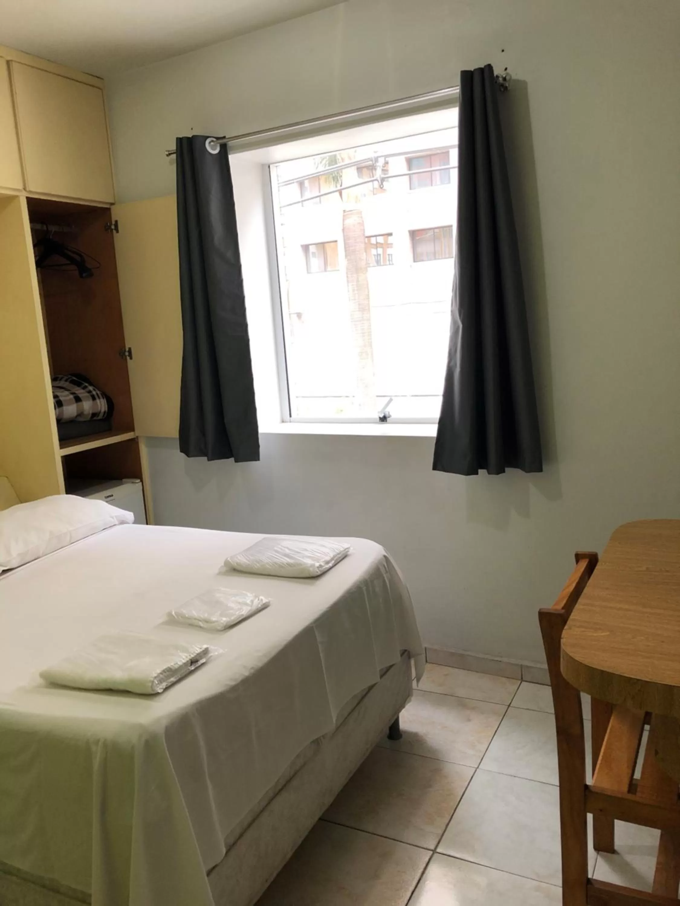 Bed in Center Plaza Hotel