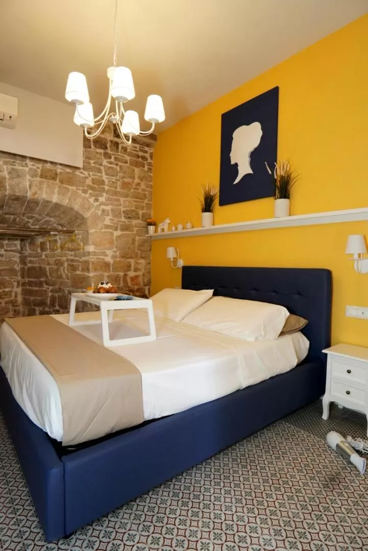 Bed in Cecenero Rooms