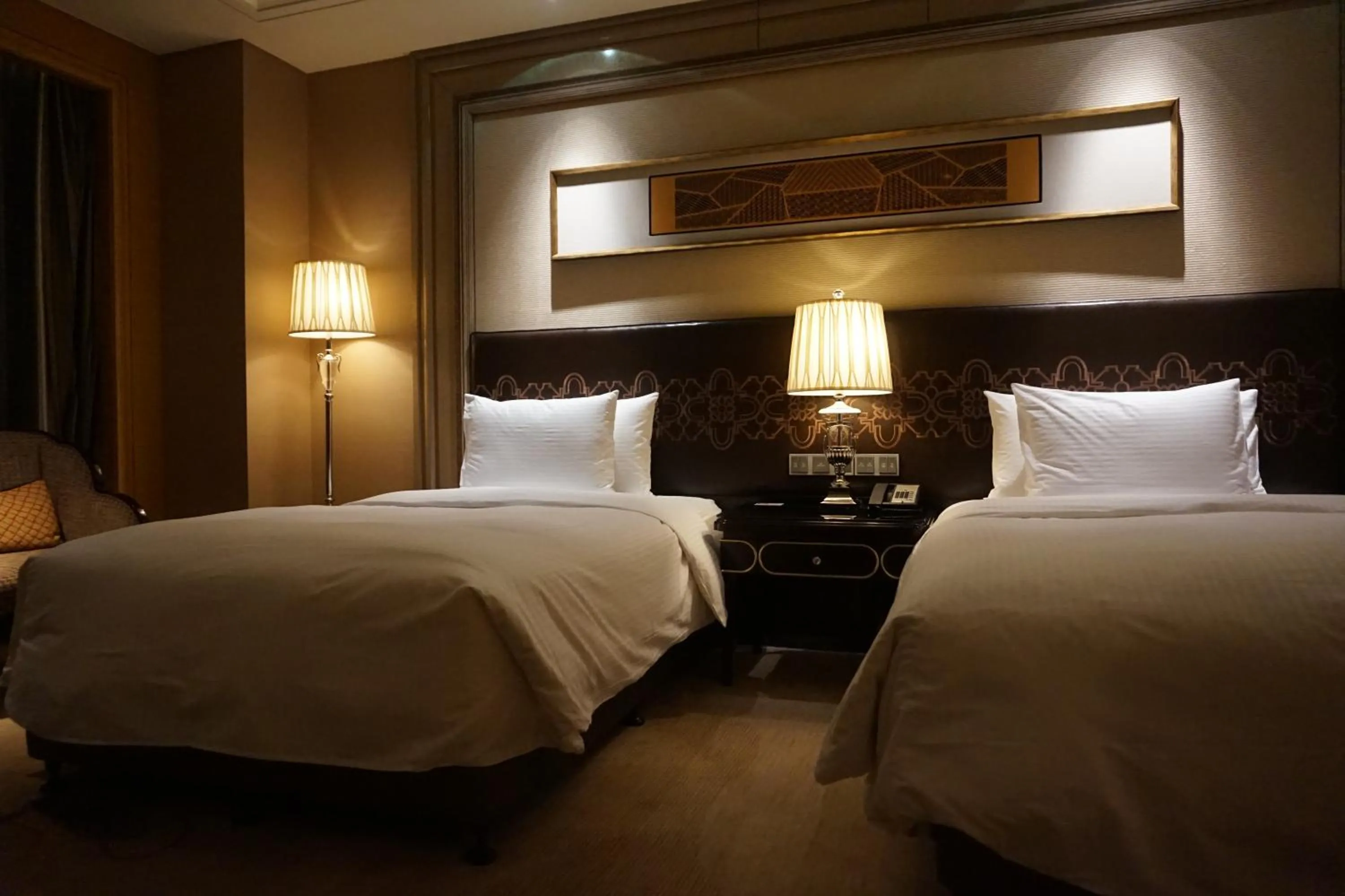 Bed in Wanda Realm Harbin Hotel