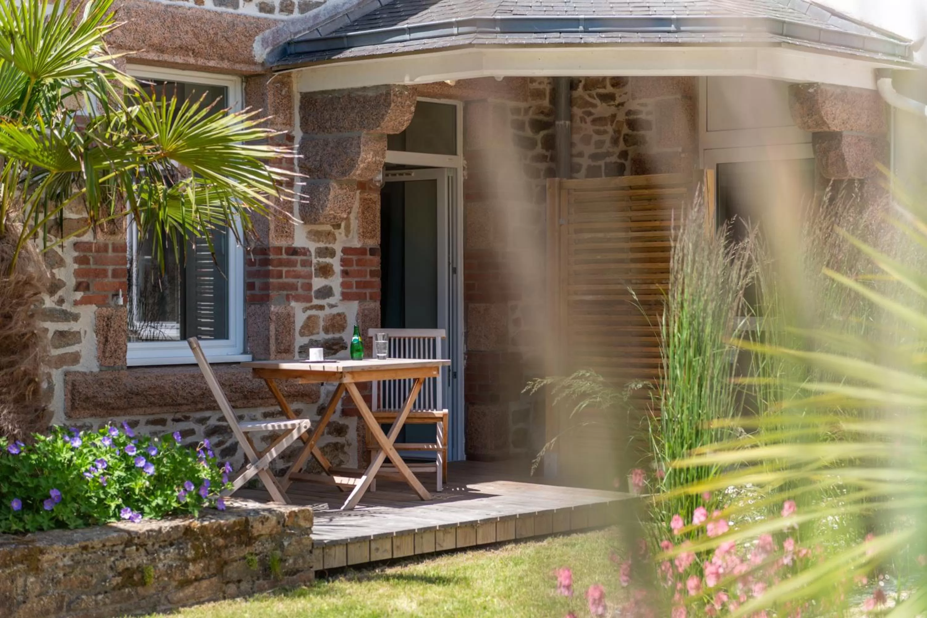 Patio in Hôtel Les Costans, The Originals Relais