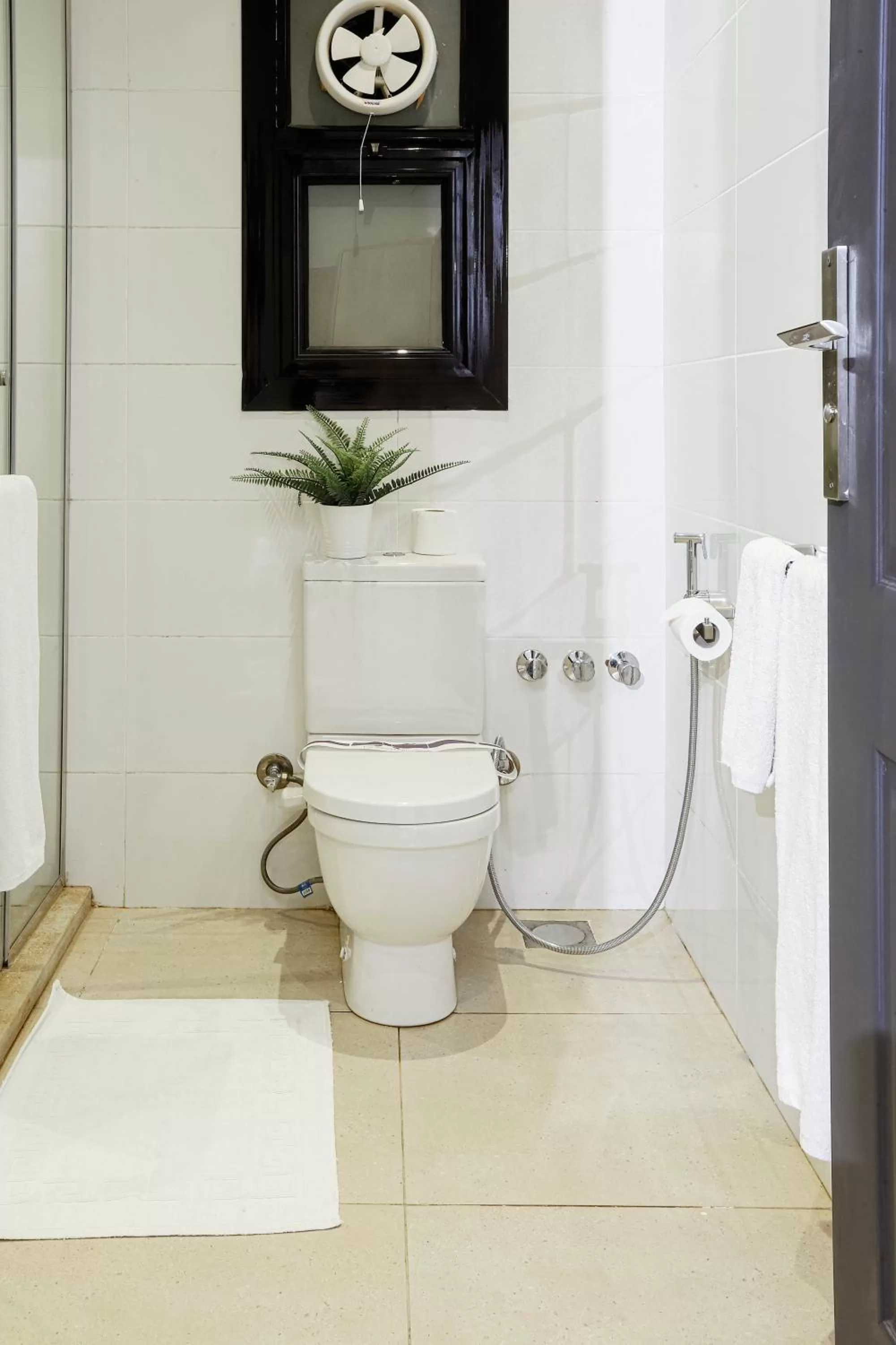 Toilet in NewCity Hotel & Suites