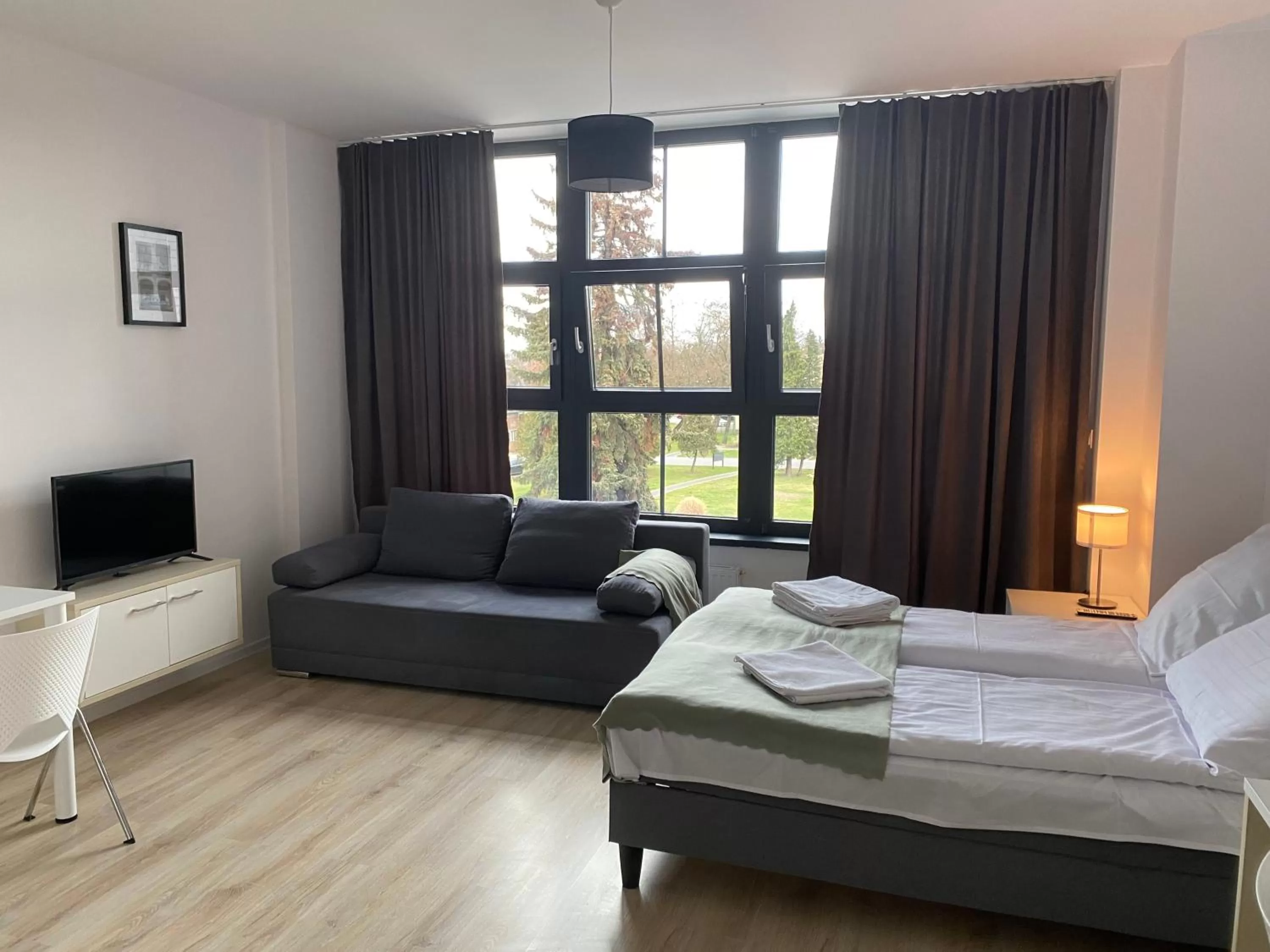 Bed in SleepWell Apartments