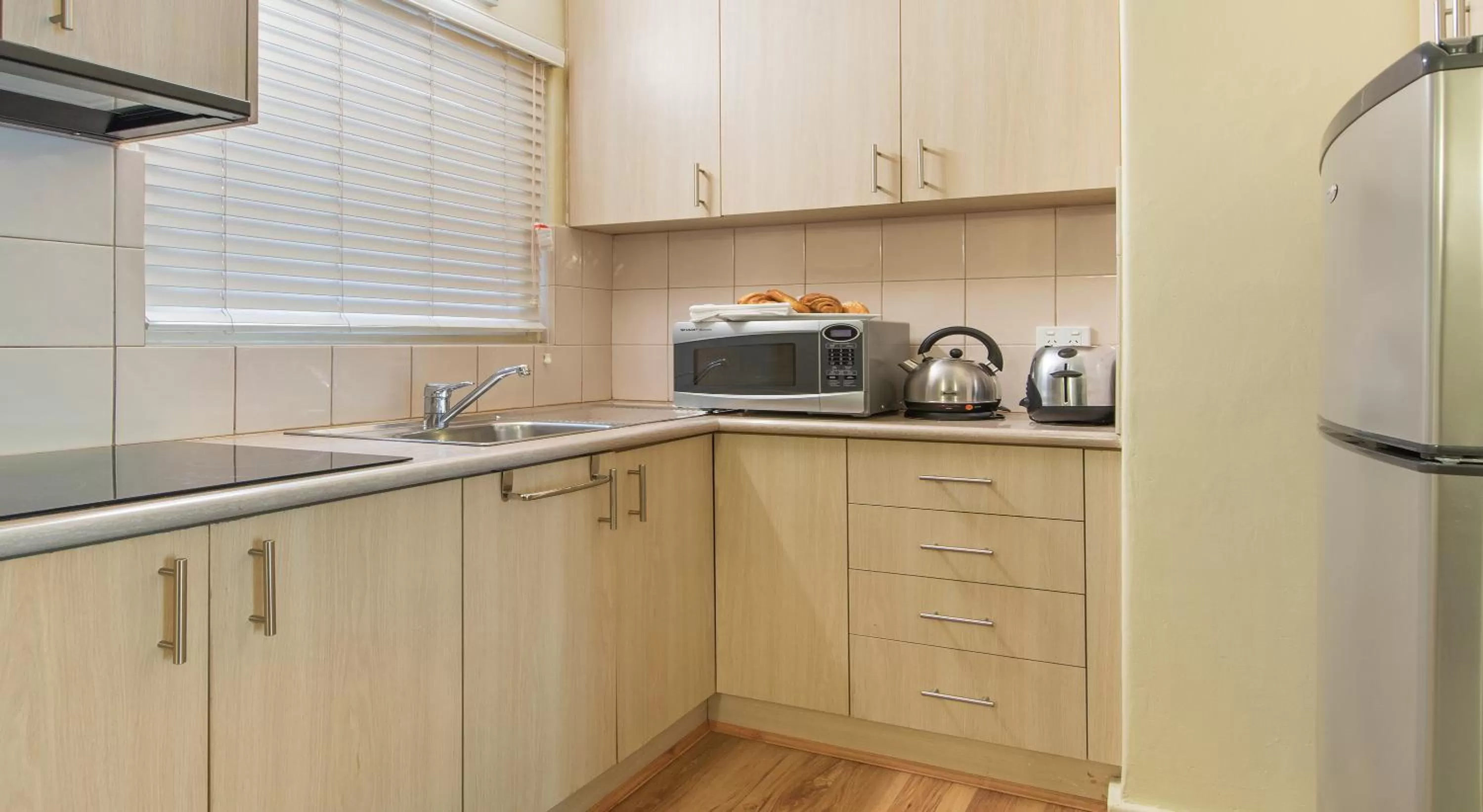 Kitchen or kitchenette in The Peninsula Riverside Serviced Apartments