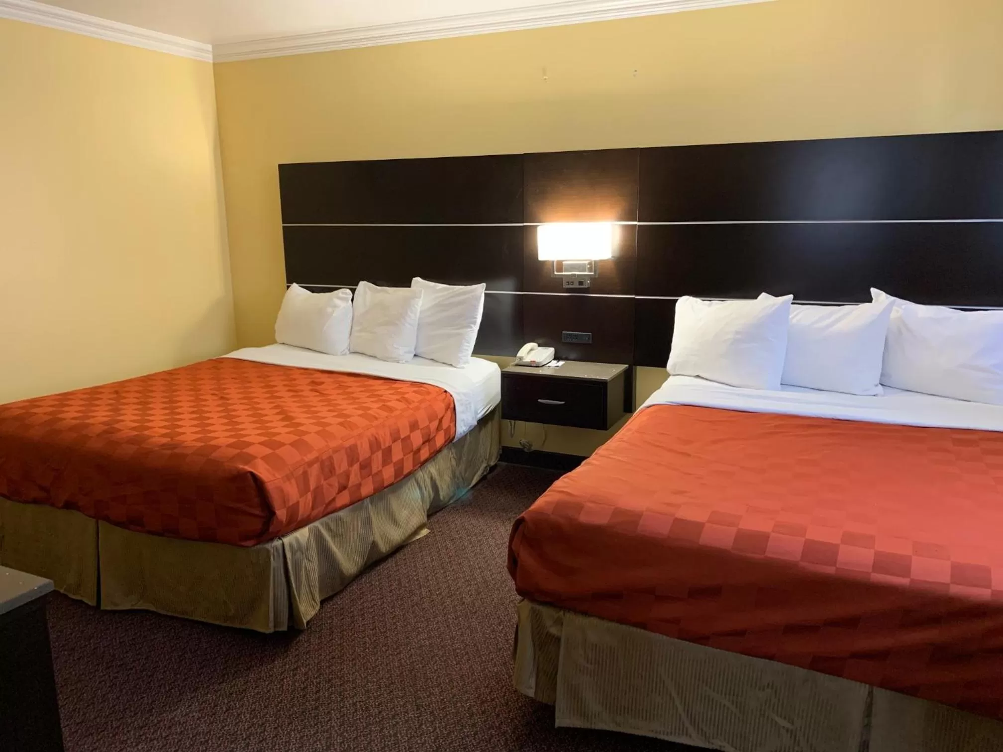 Bed in Olive Tree Inn & Suites