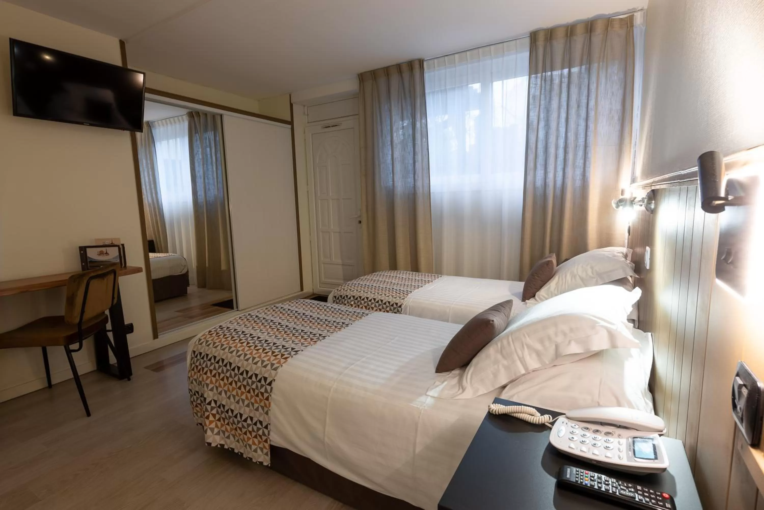 Bed in Logis Hôtel Rêve de Sable