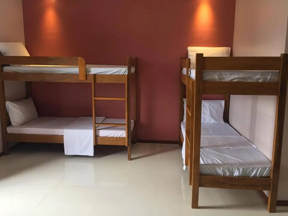 Bed in Squares Beachside Apartments