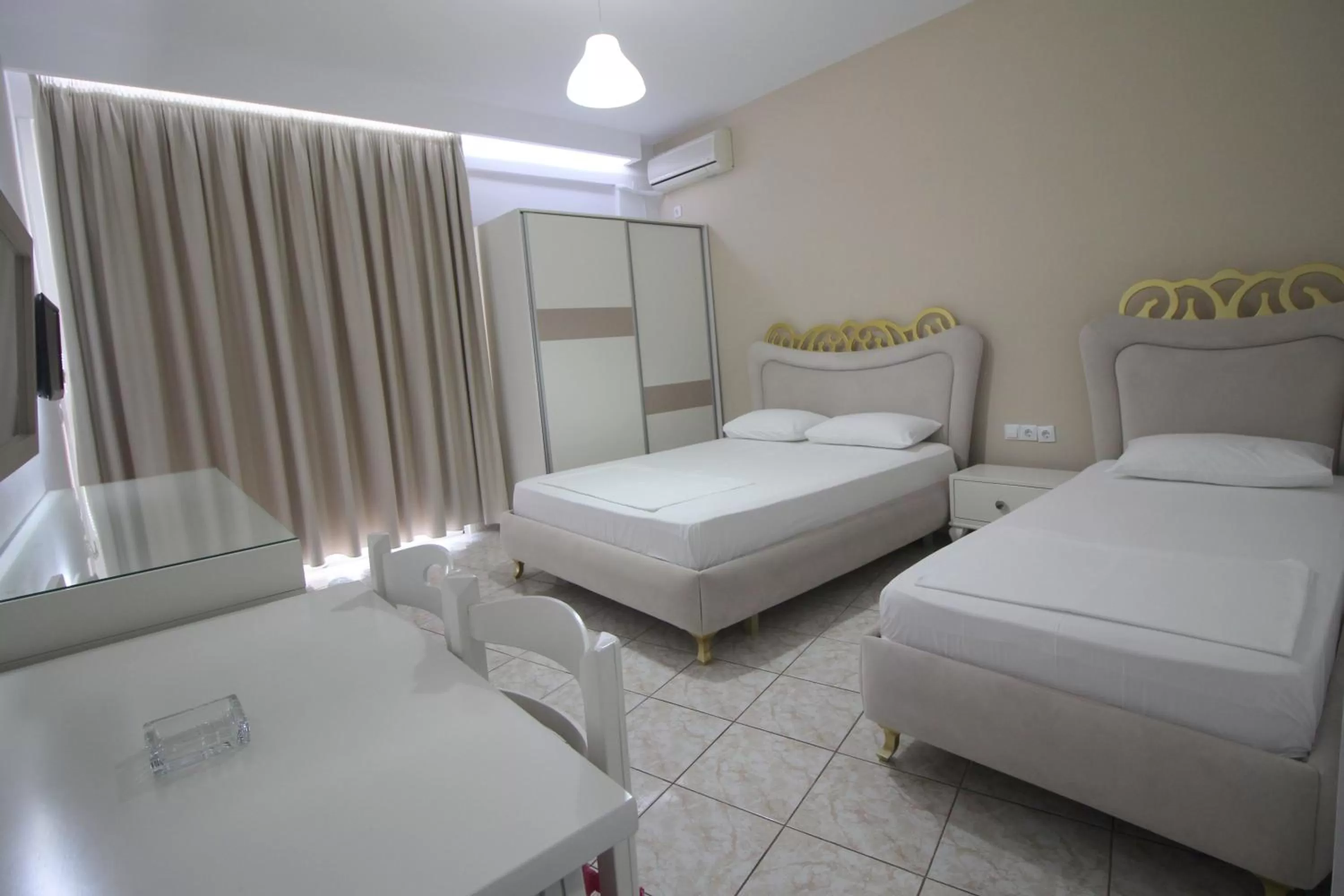 Bed in Murati Suites Sarandë