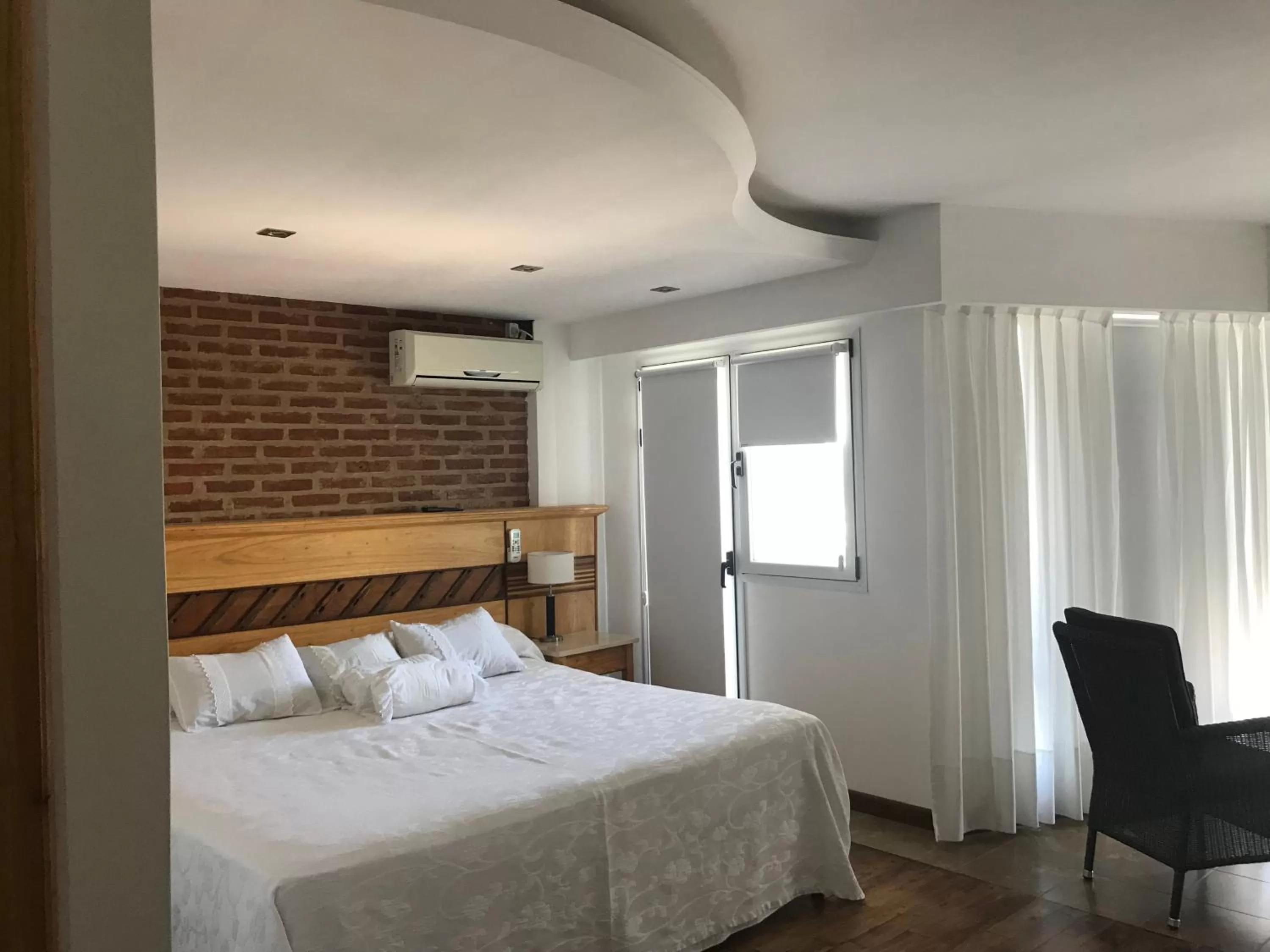 Bed in Costanera Mar Hotel & Suites