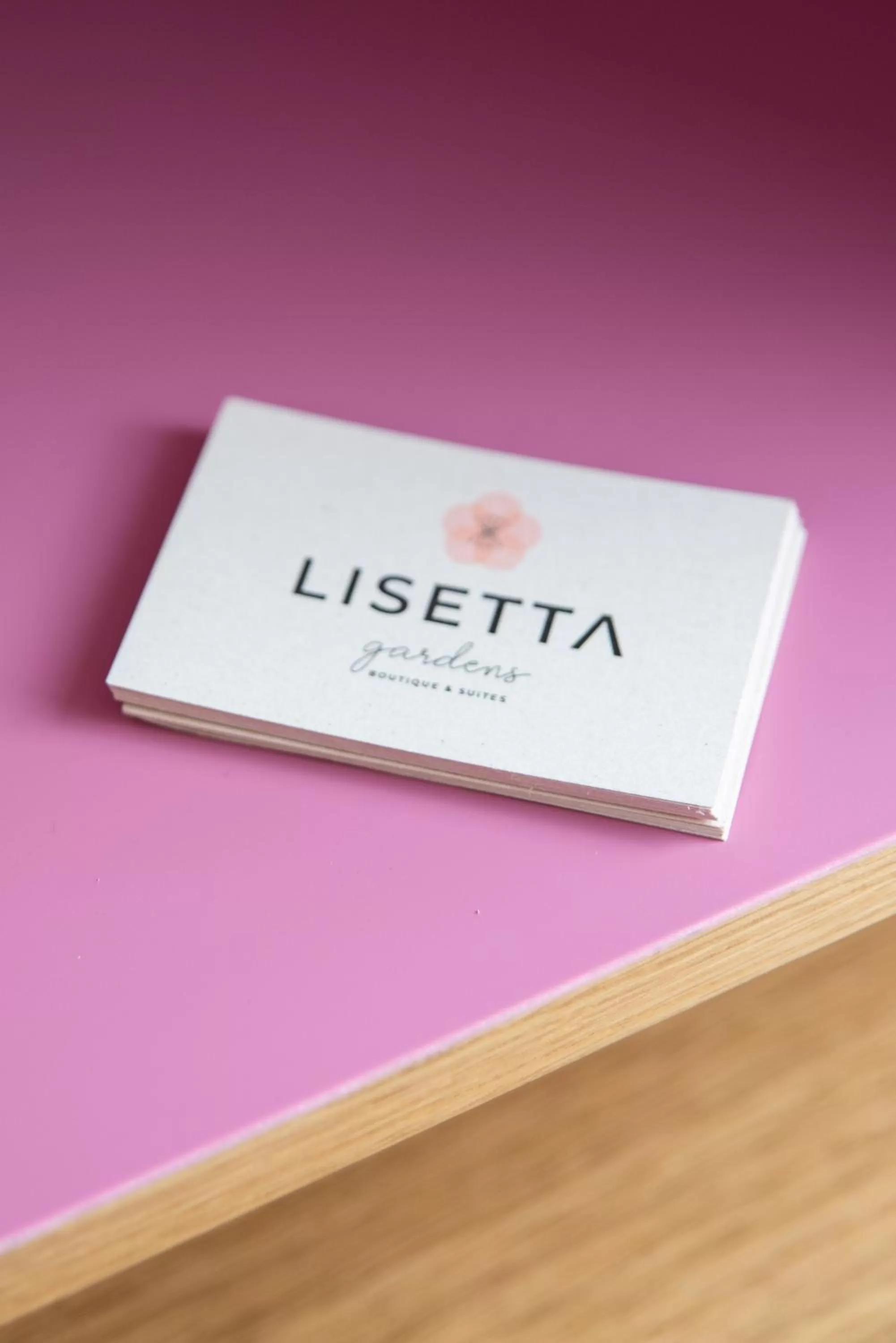 Property logo or sign in Lisetta Gardens Boutique & Suites