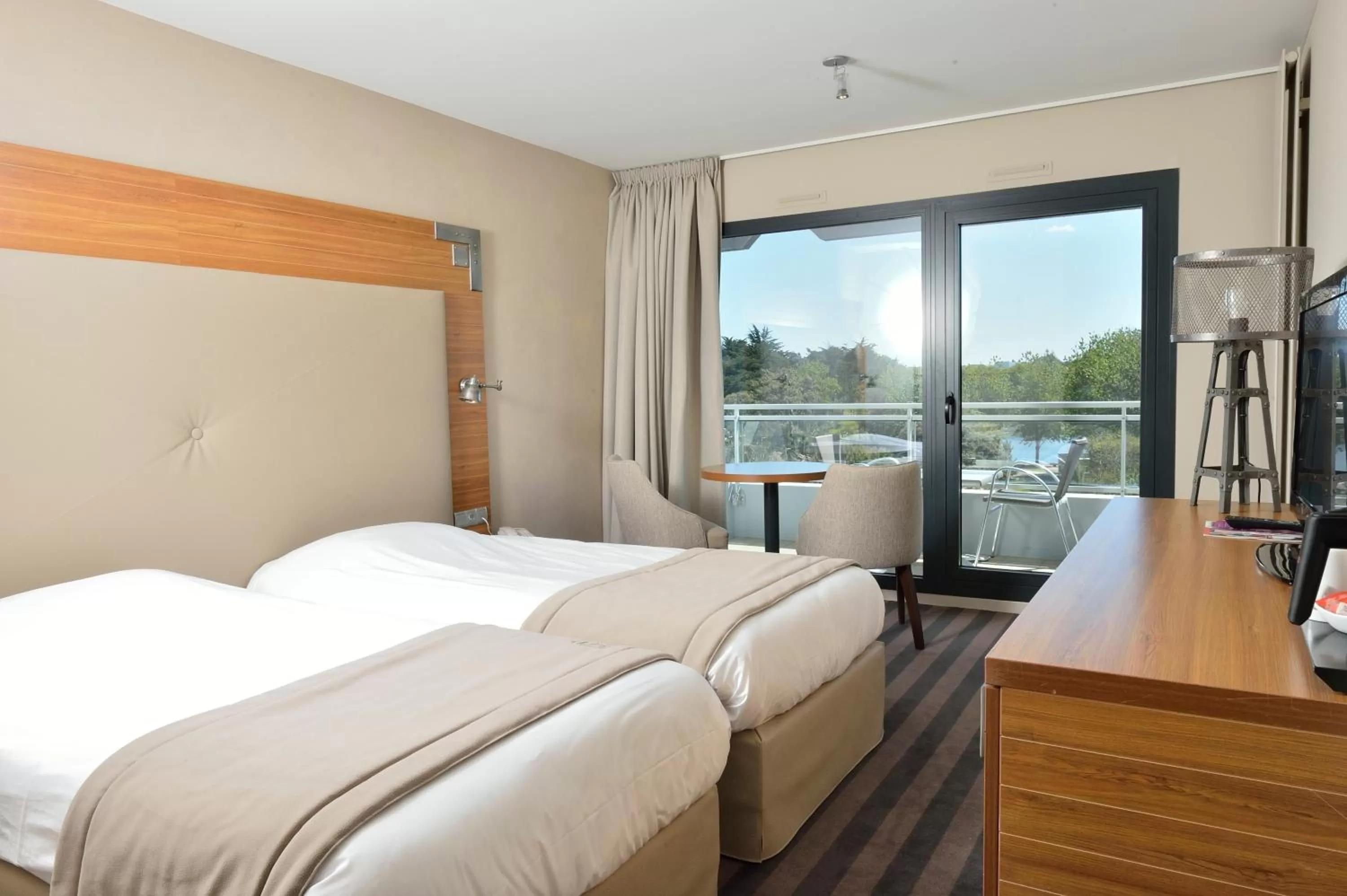 Photo of the whole room, Bed in Côte Ouest Thalasso & Spa Les Sables d'Olonne - MGallery Collection