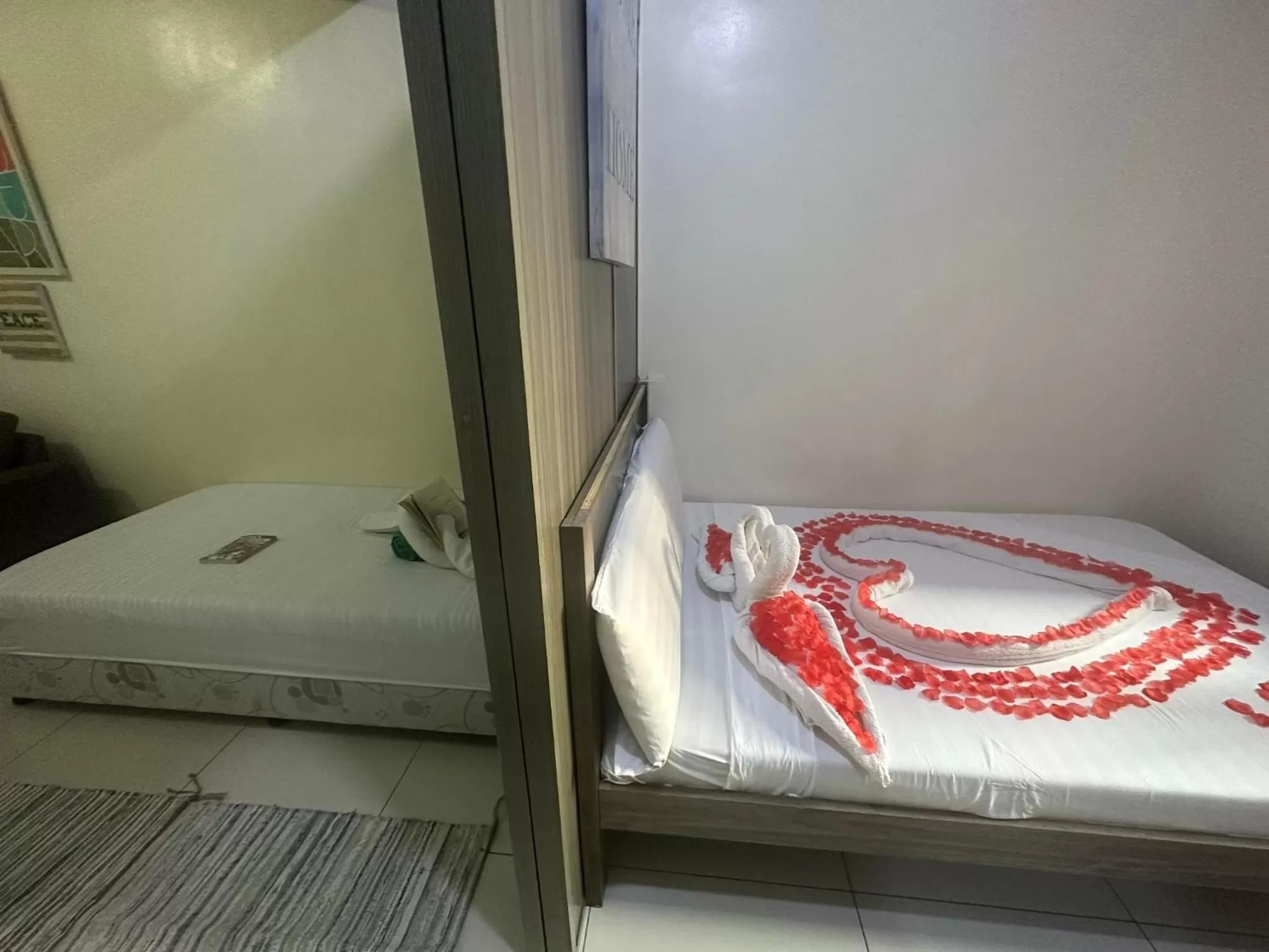 Bed in Green Residences Stays by PBYY