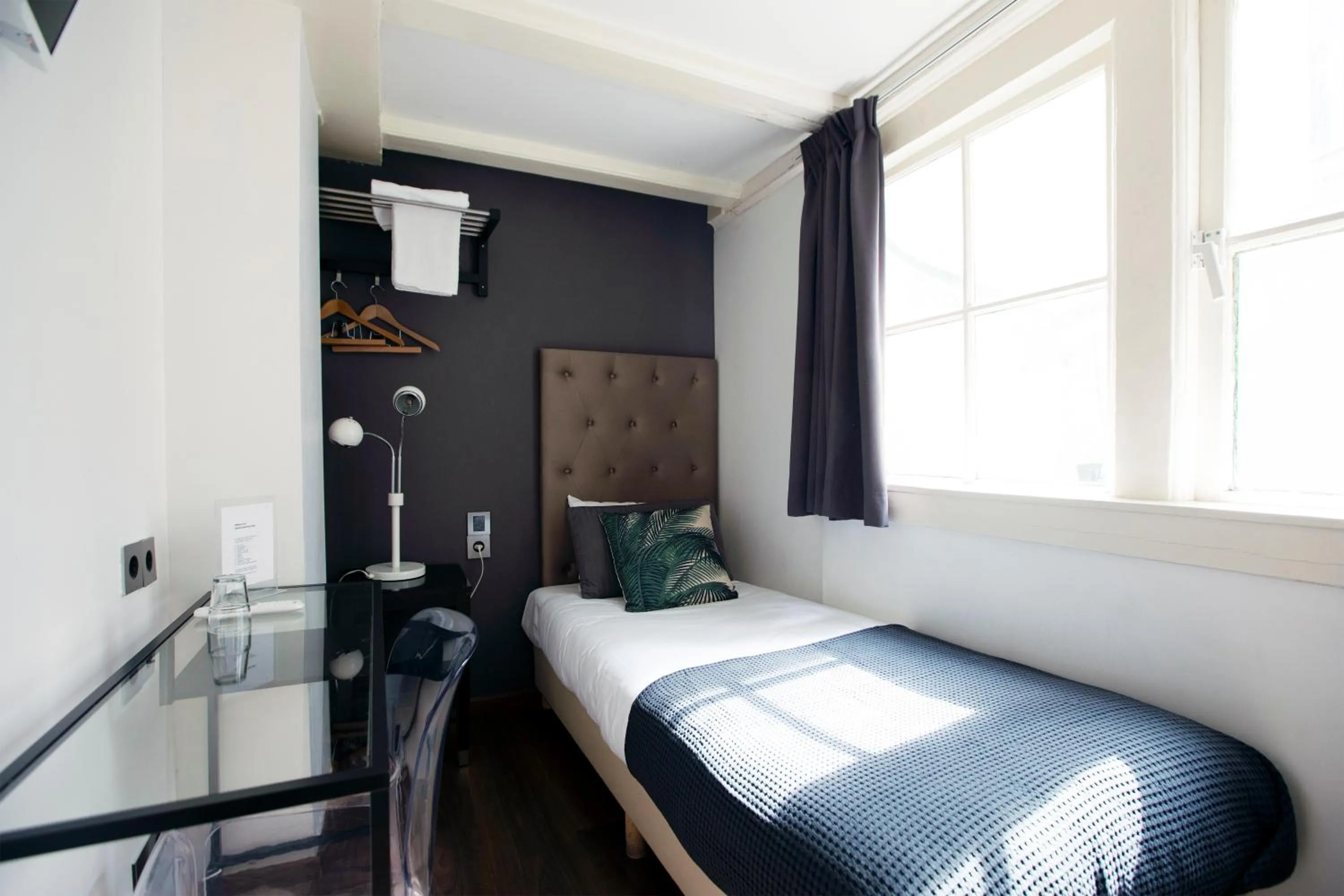 Bed in Quentin Golden Bear Hotel