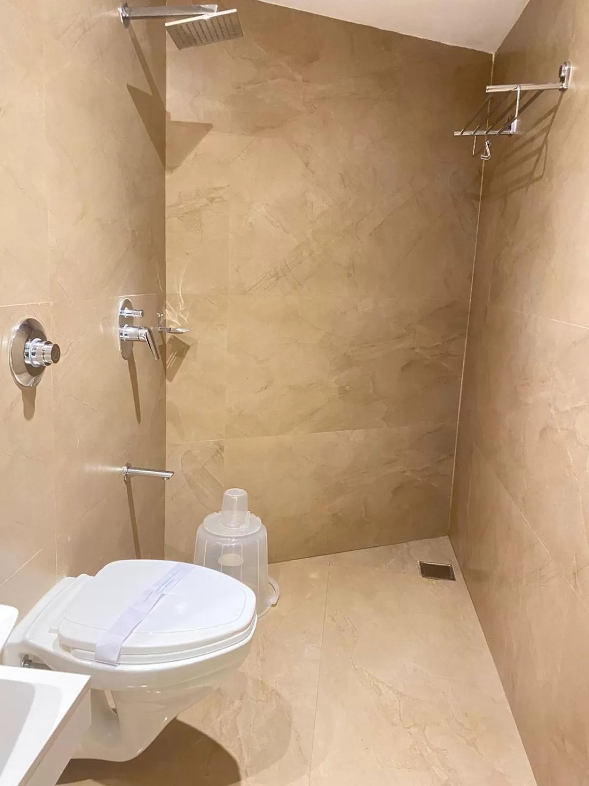 Shower in Hotel Plaza Heights by RAK Rooms, Mangaluru