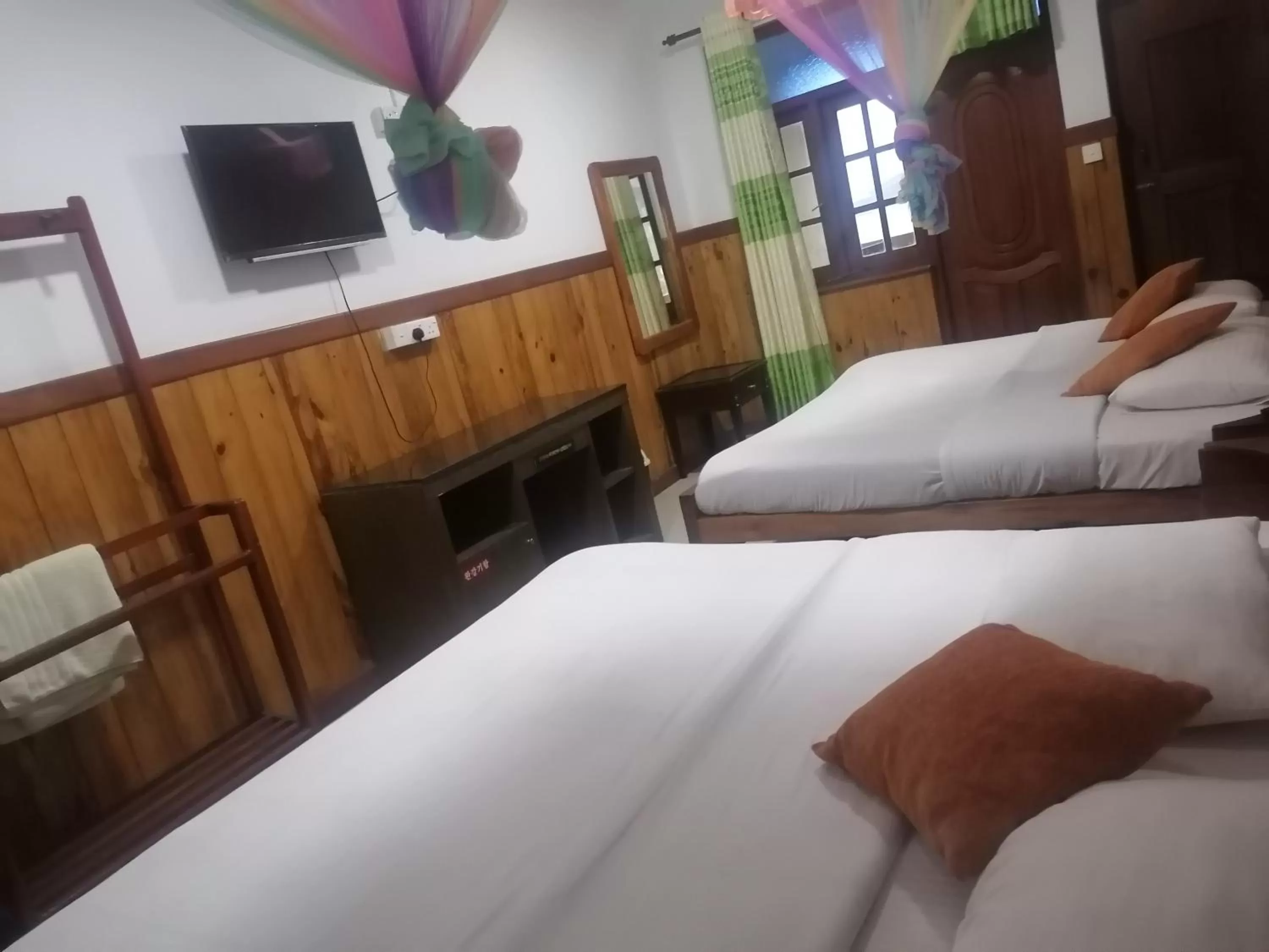 Bed in Srilak View Holiday Inn