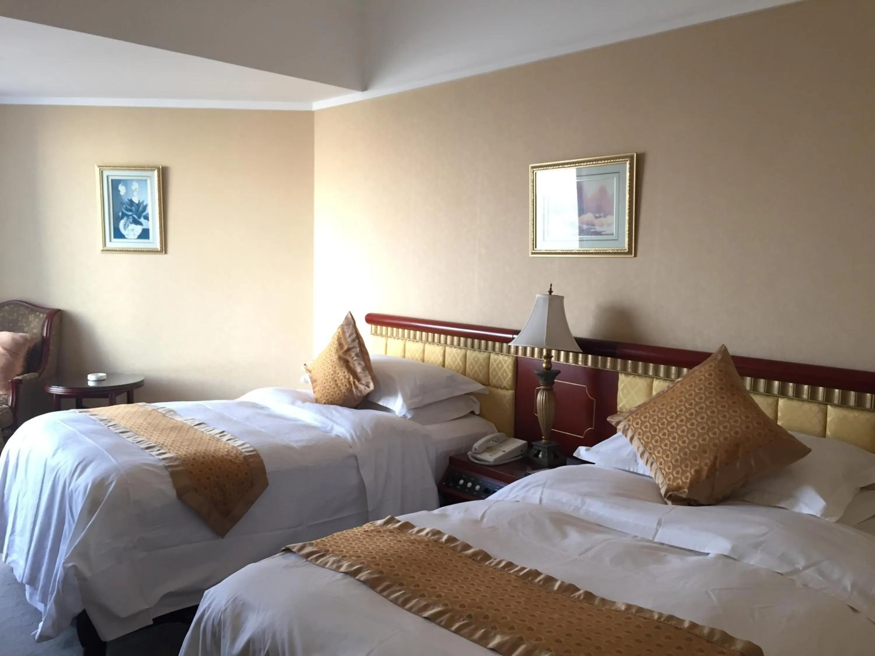 Bed in Huiquan Dynasty Hotel Qingdao