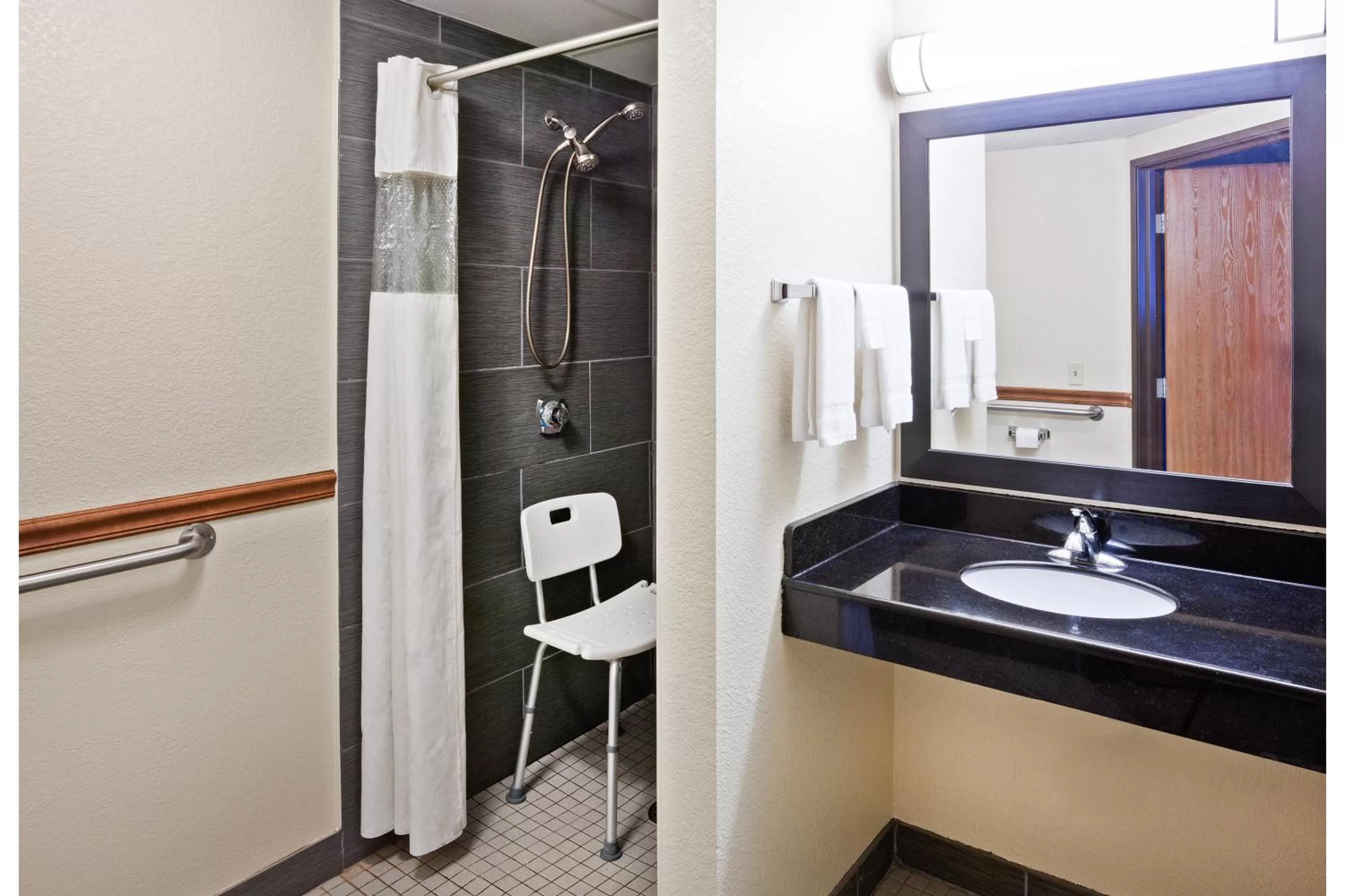 Bathroom in AmericInn by Wyndham Plover Stevens Point