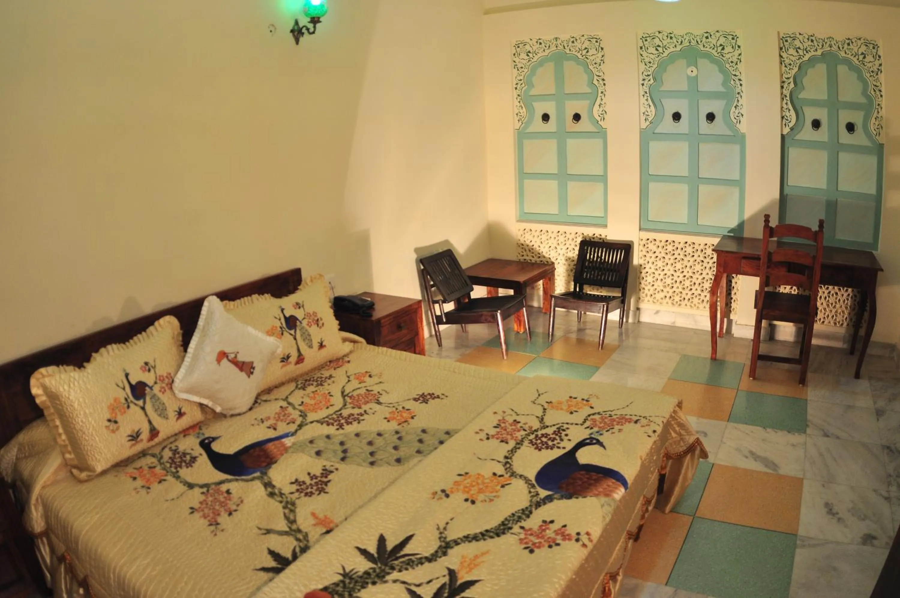 Bed in Rani Mahal Hotel