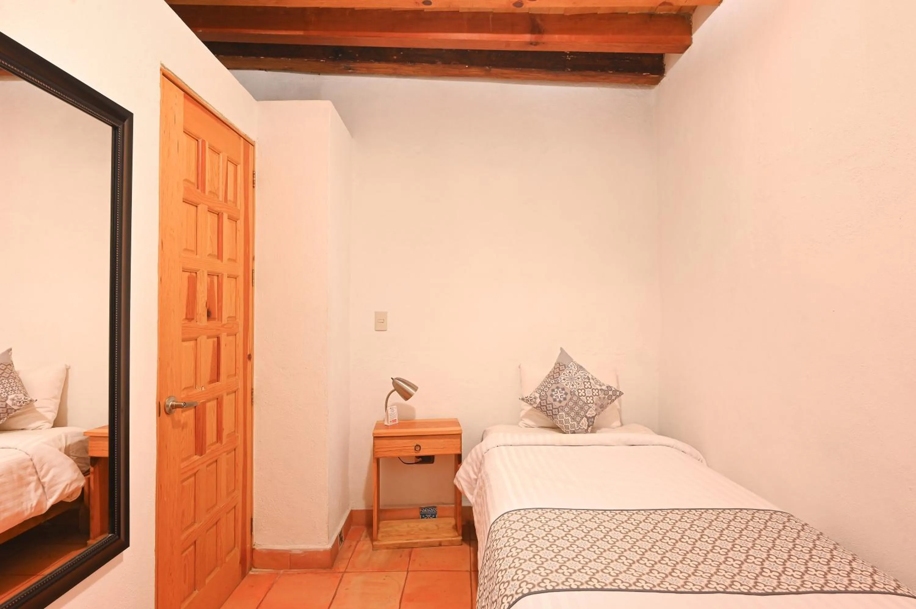 Bed in Hotel Meson Cuevano