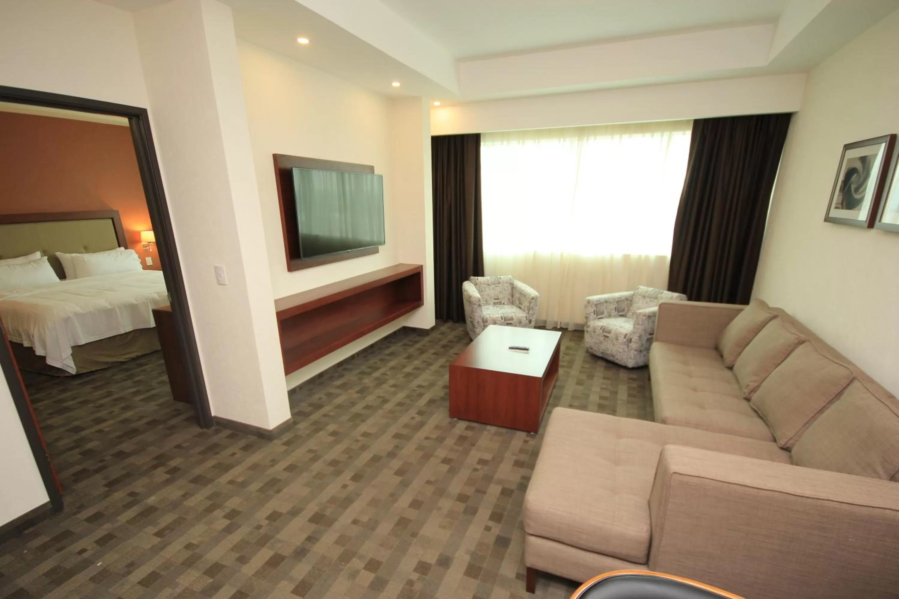 Photo of the whole room, Bed in Holiday Inn & Suites Plaza Mayor by IHG