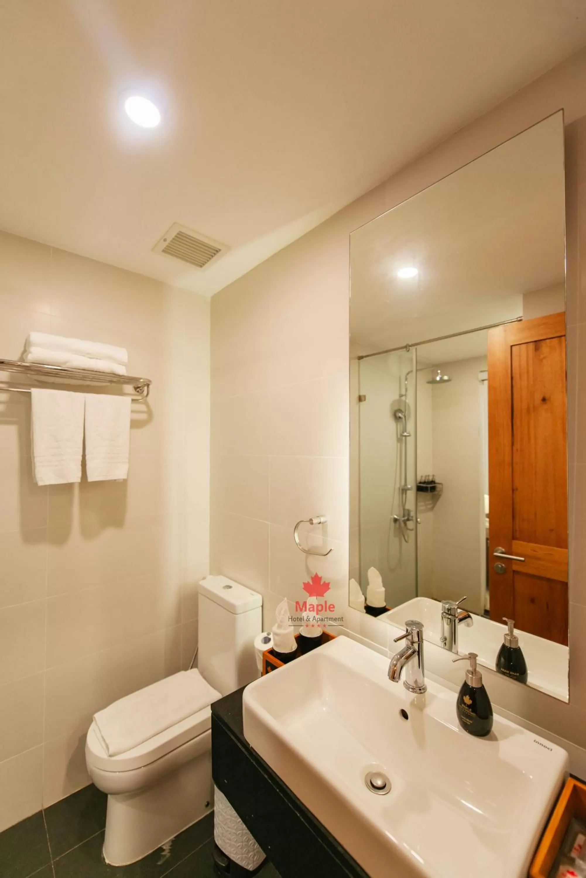 Toilet in Maple Hotel & Apartment