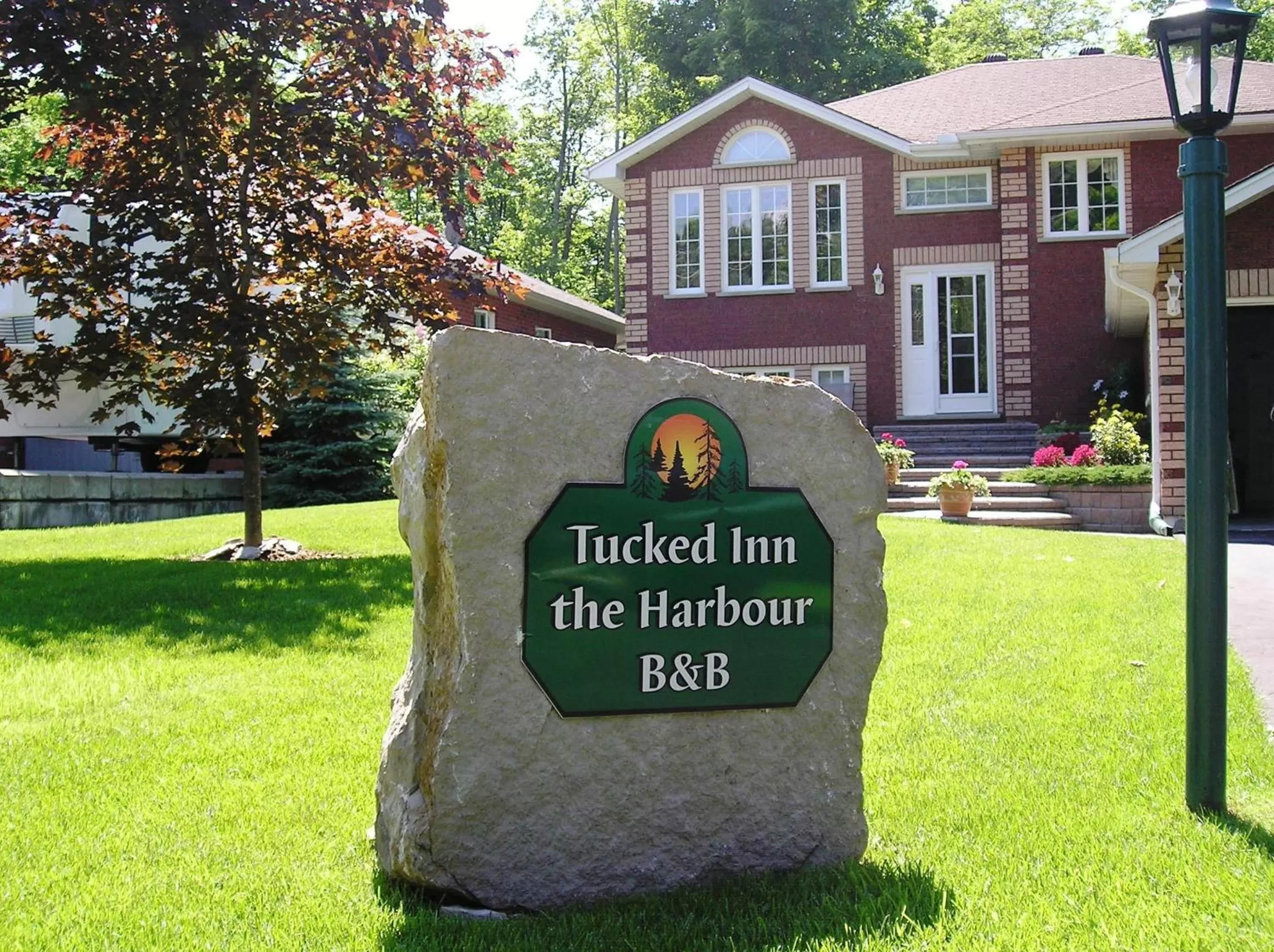 Logo/Certificate/Sign in Tucked Inn the Harbour B&B
