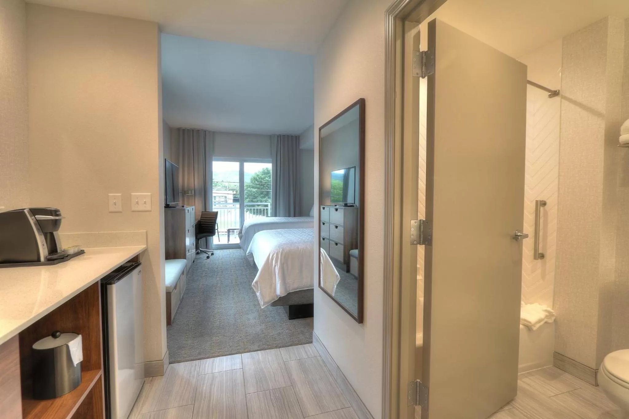 Photo of the whole room, Bed in Holiday Inn & Suites Pigeon Forge Convention Center by IHG