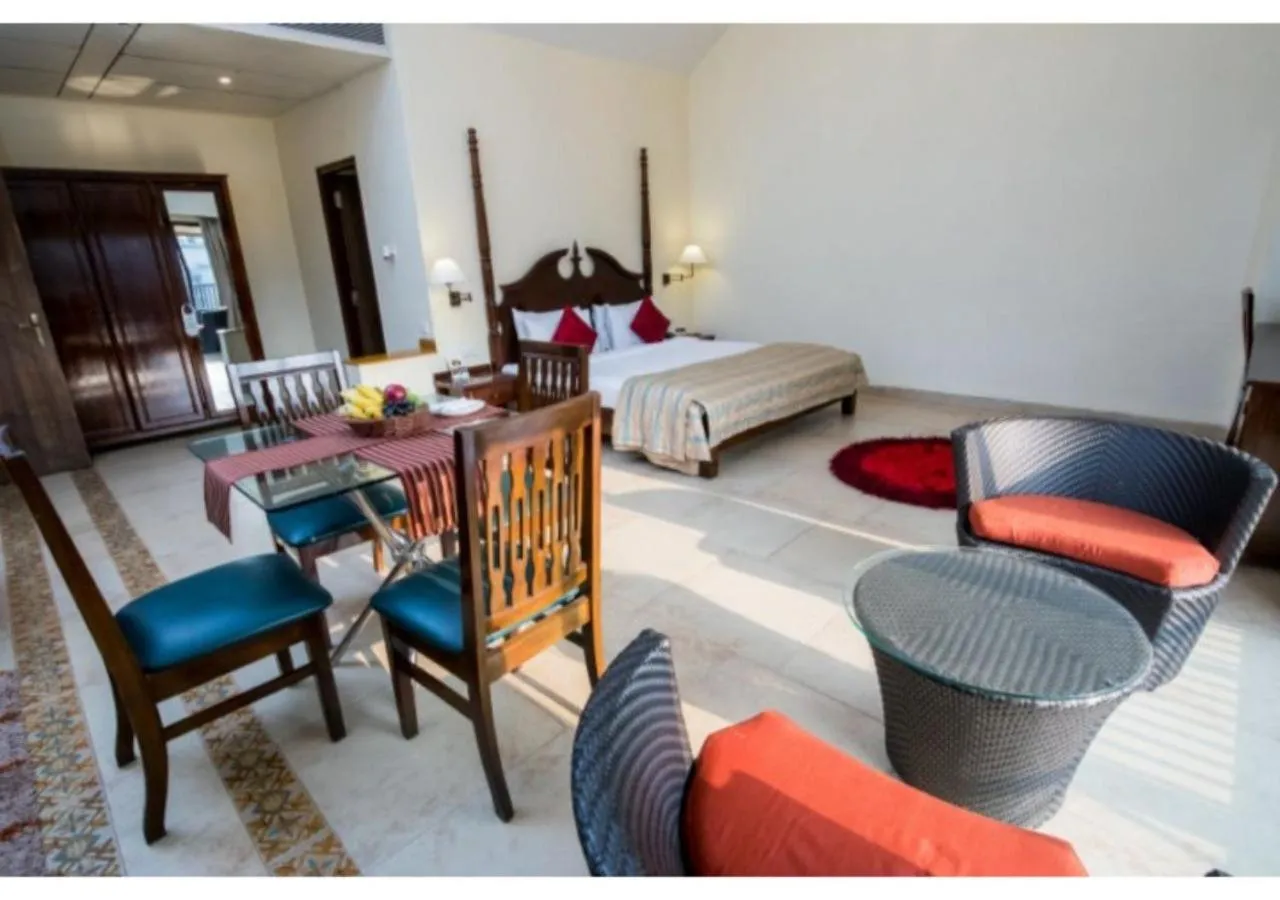 Living room, Bed in Neelam's The Grand Hotel Goa