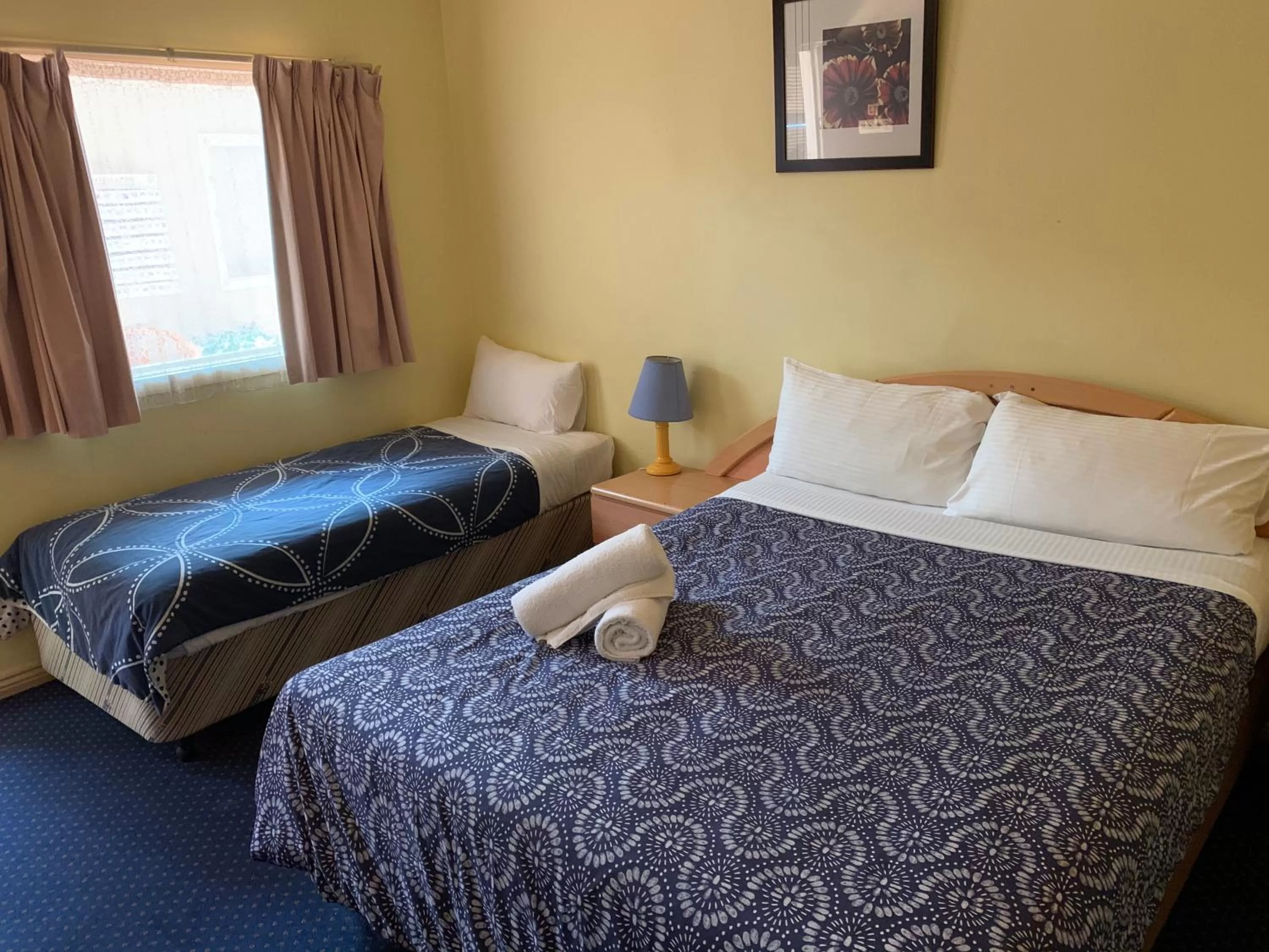 Bed in City East Motel