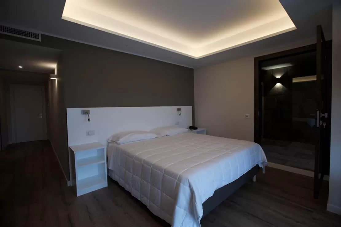 Bed in Onorati Hotel