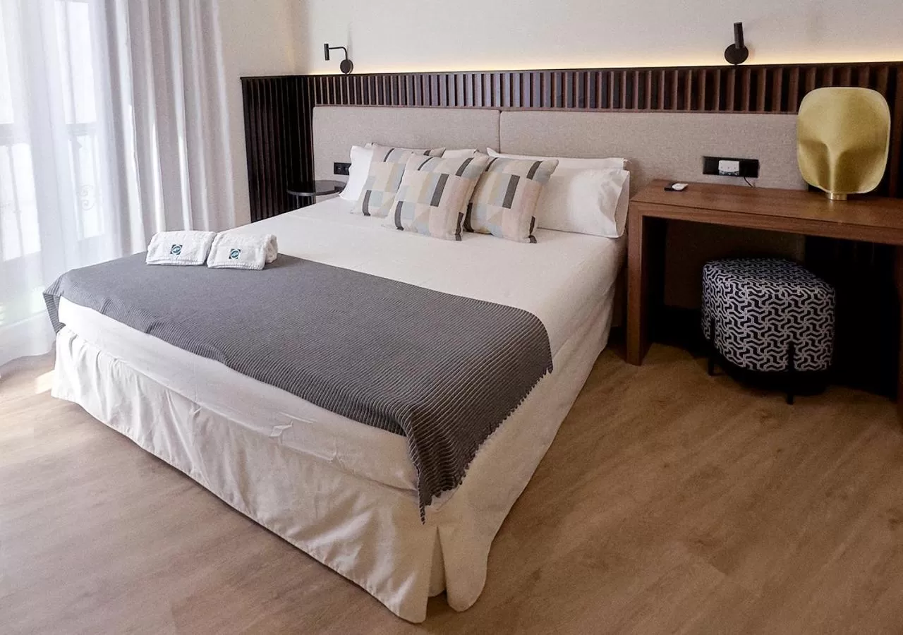Bed in ISA Sevilla Suites