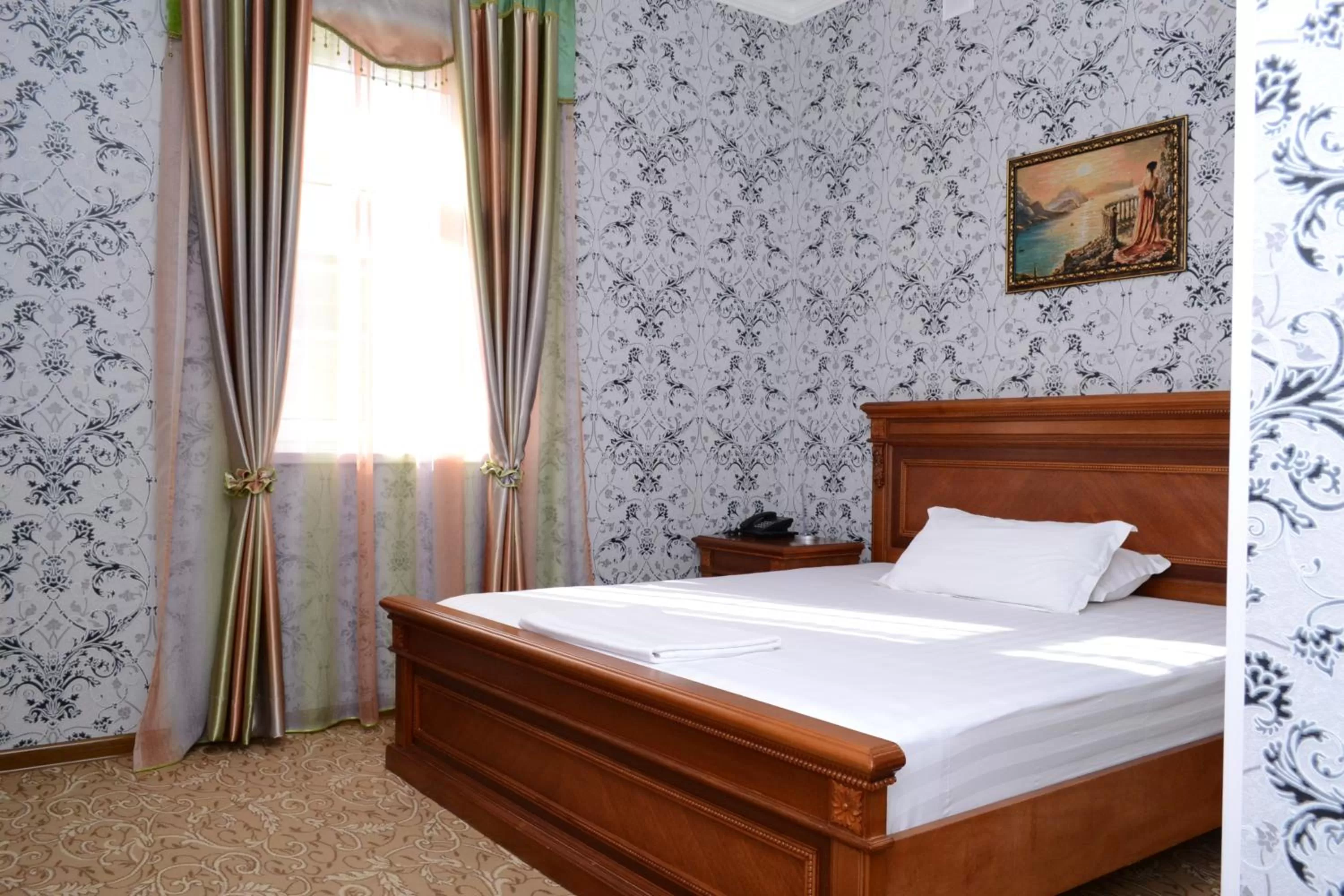 Bed in Maximum Hotel