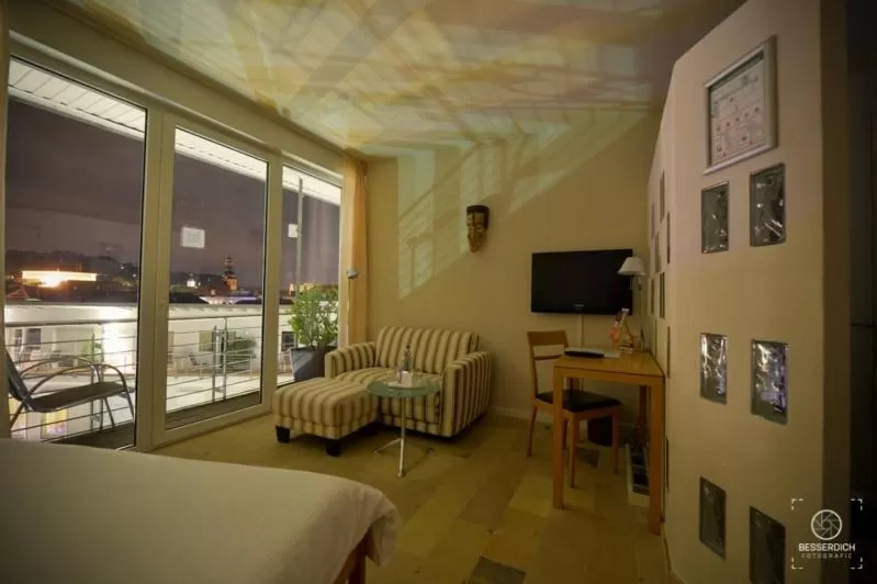 Seating area, Bed in Domaine Leidinger