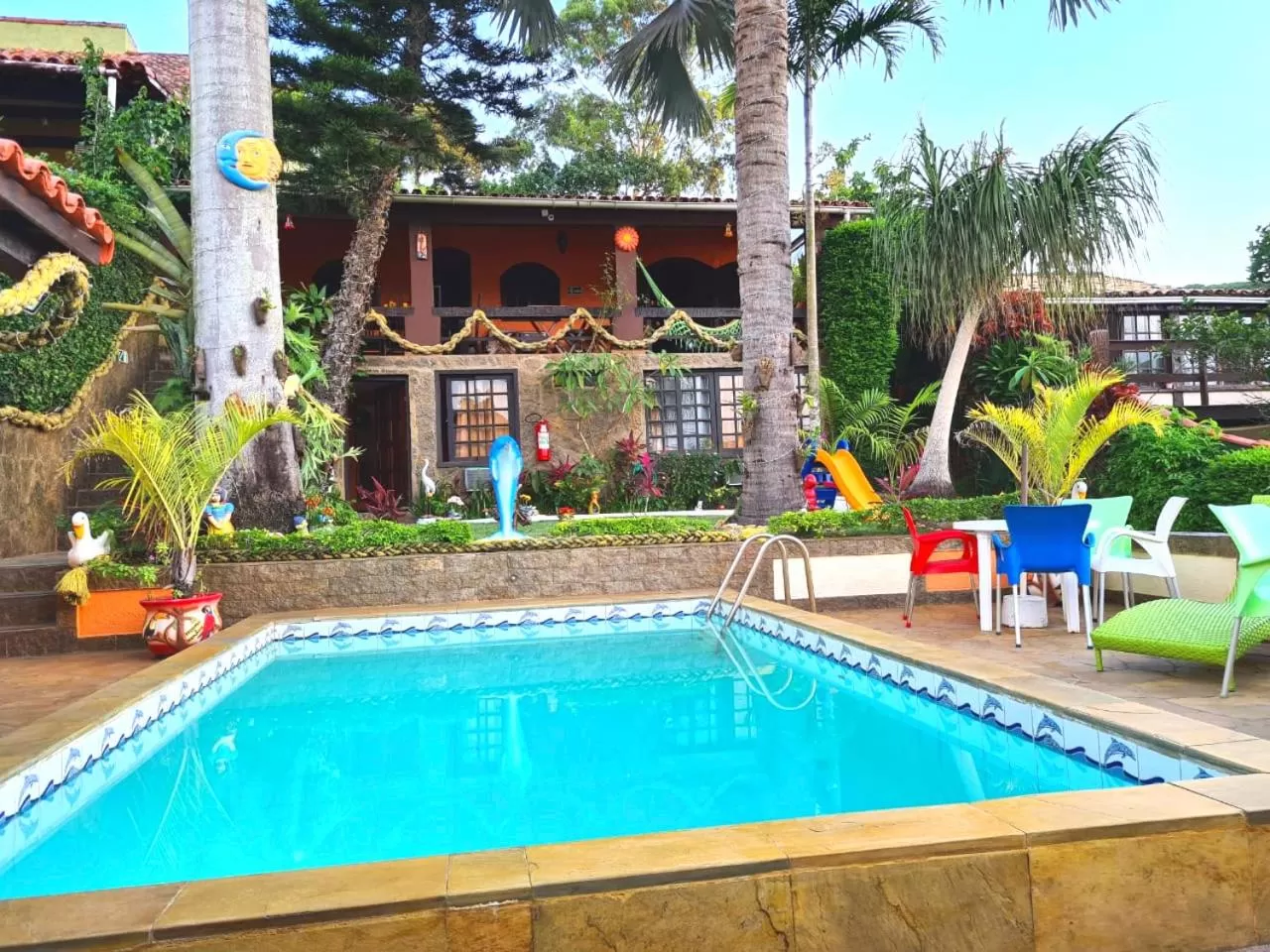 Swimming pool in Suítes Casa do Barão