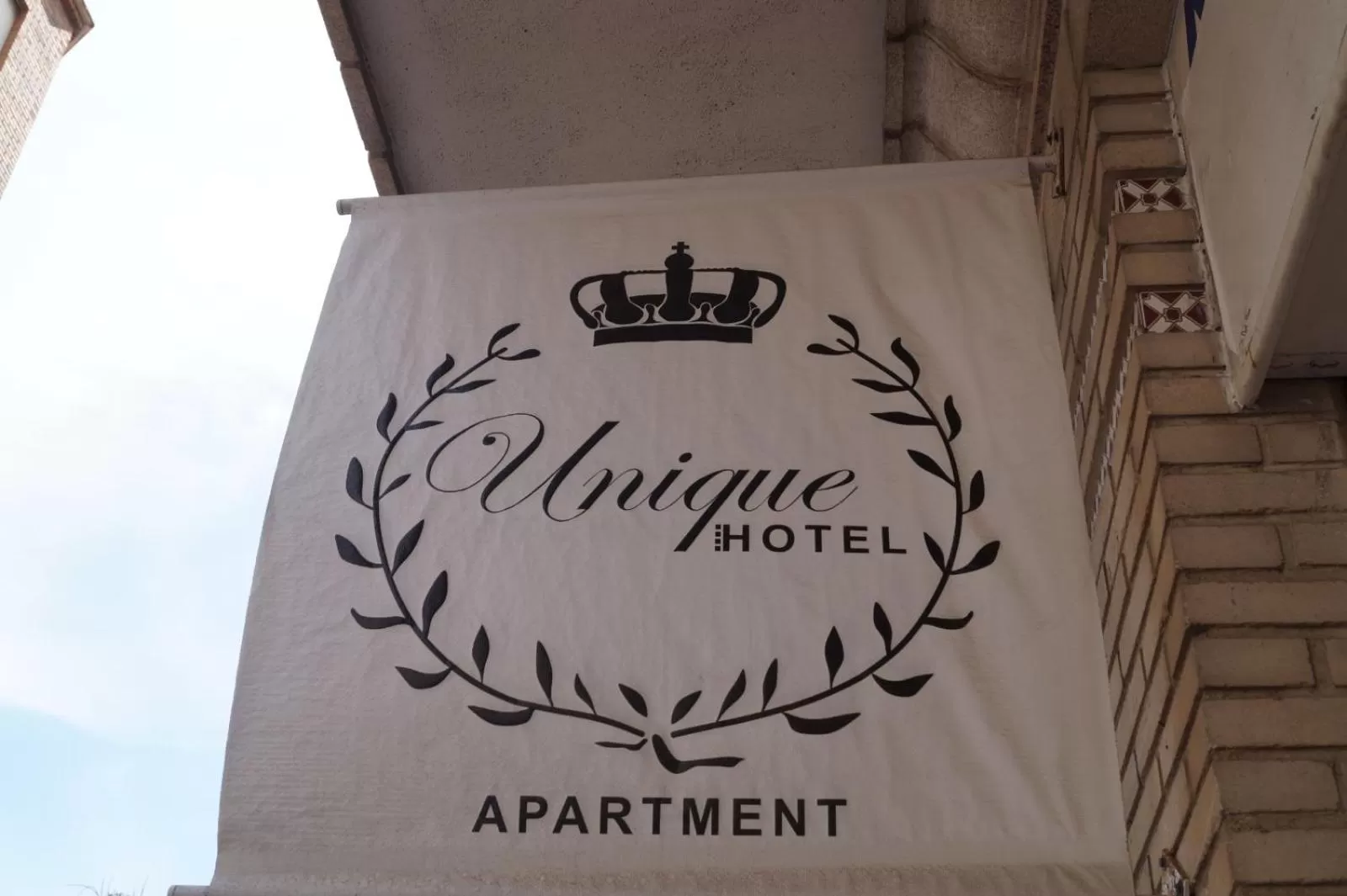 Property logo or sign in Unique Hotel Apartments