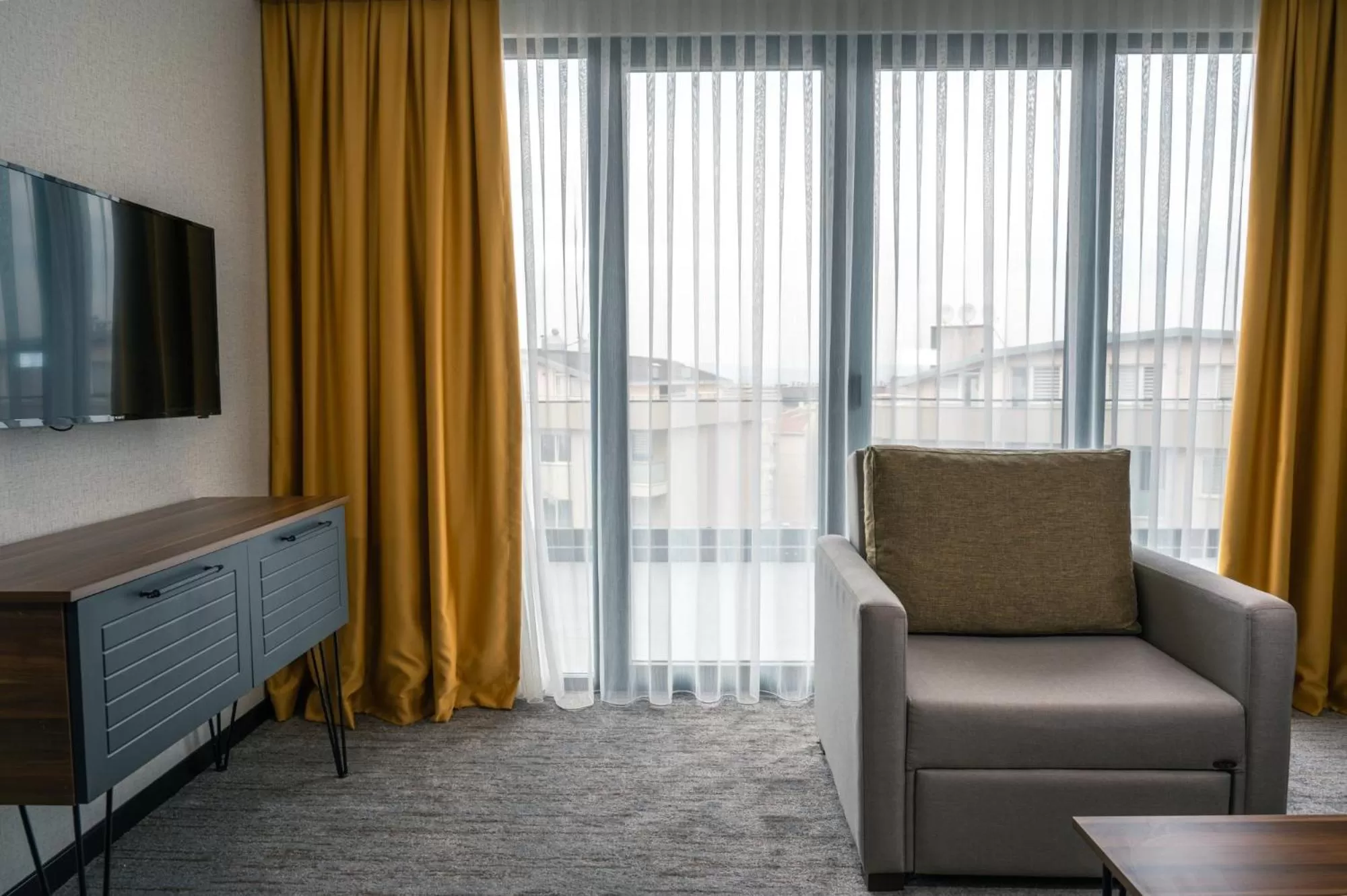 Communal lounge/ TV room in Leo Suites