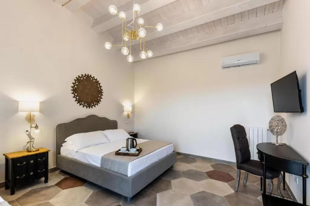 Seating area, Bed in Baglio Genovesi