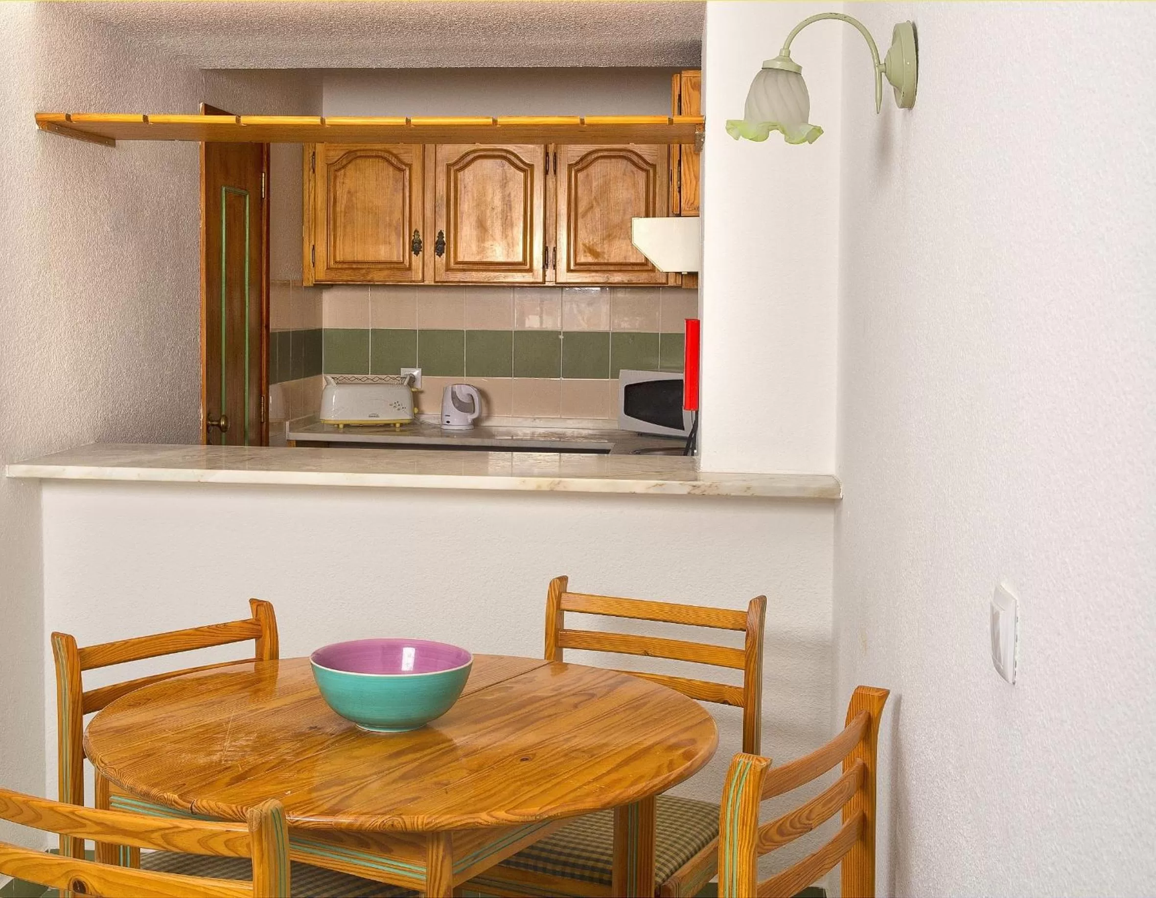 Kitchen or kitchenette in Ourabay Hotel Apartamento - Art & Holidays