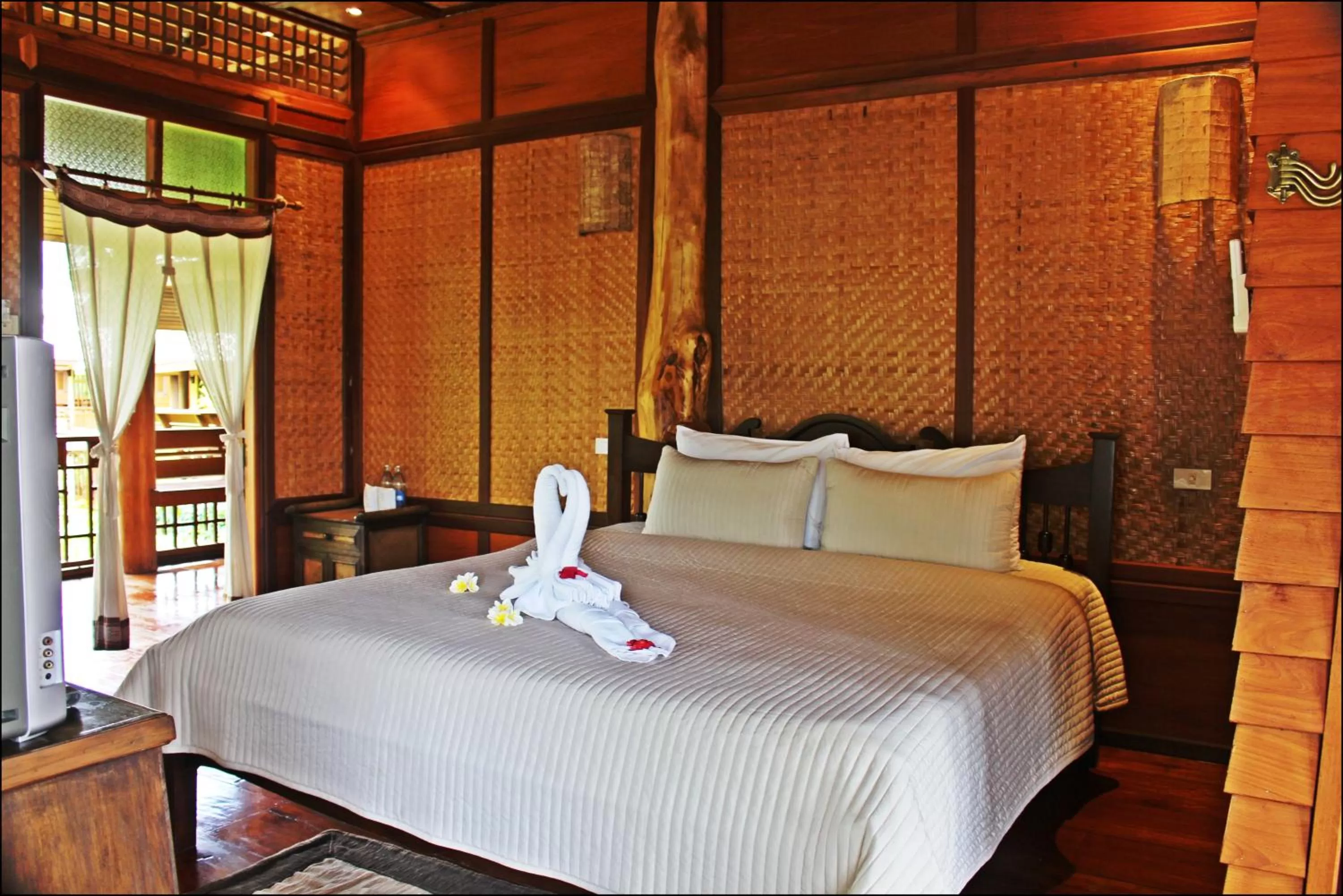 Bed in Pai Vimaan Resort