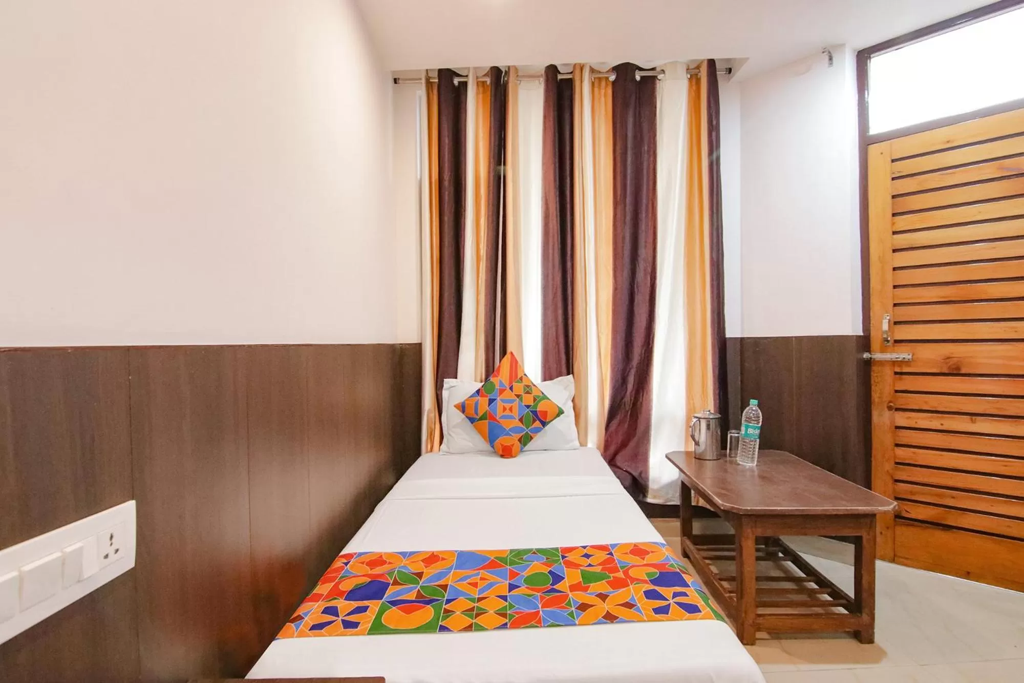 Bed in FabHotel Rosewood Inn I